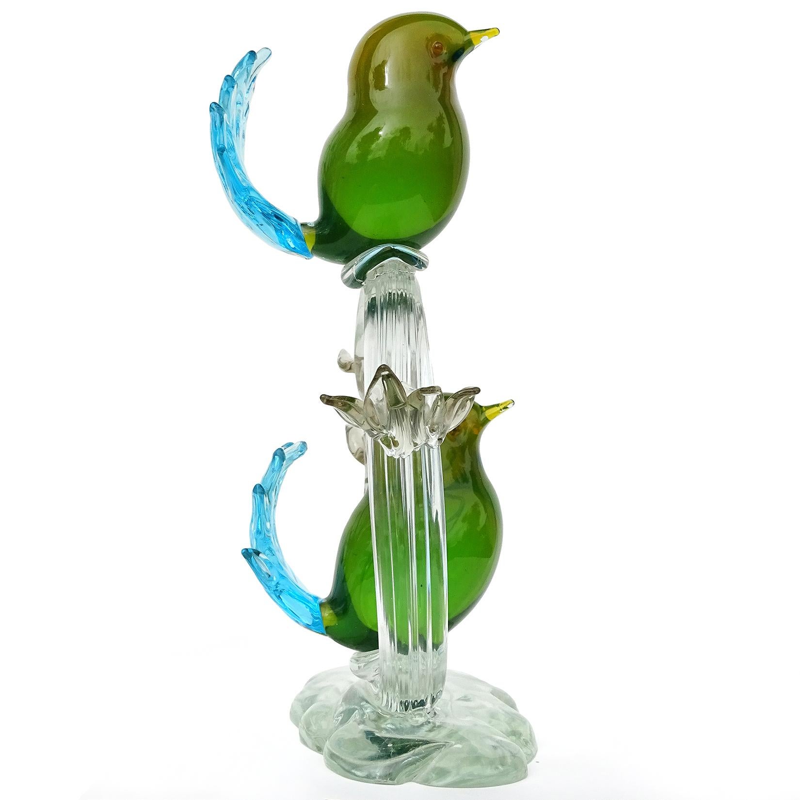 Beautiful and large, vintage Murano hand blown Sommerso green yellow, with blue tails Italian art glass birds sculpture. Attributed to the Salviati company. The birds are made with some Uranium glass, and they glow under a black light (see photos).