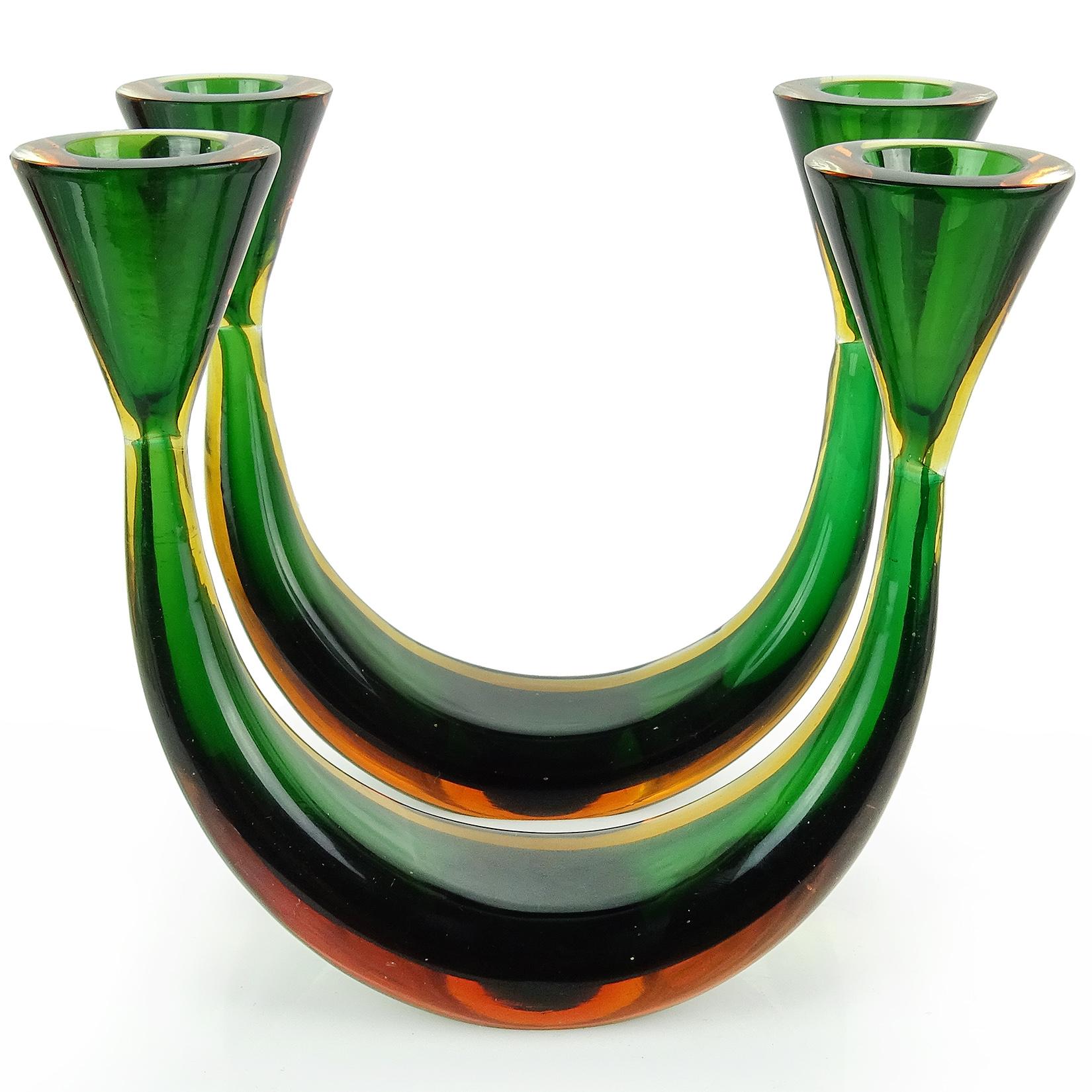 Beautiful pair of vintage Murano hand blown Sommerso green and yellow orange Italian art glass candleholder set. Created in the manner of designer Flavio Poli for Seguso Vetri D' Arte. The pieces have a Minimalist design, with a curve base and cone