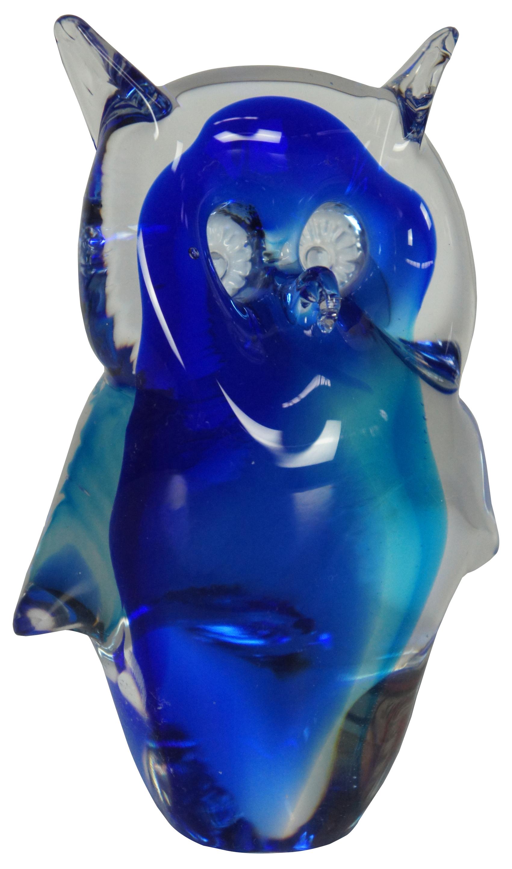 Hand blown Italian art glass figurine of a small blur horned owl with curling beak and deeply set cane eyes. Measure: 5