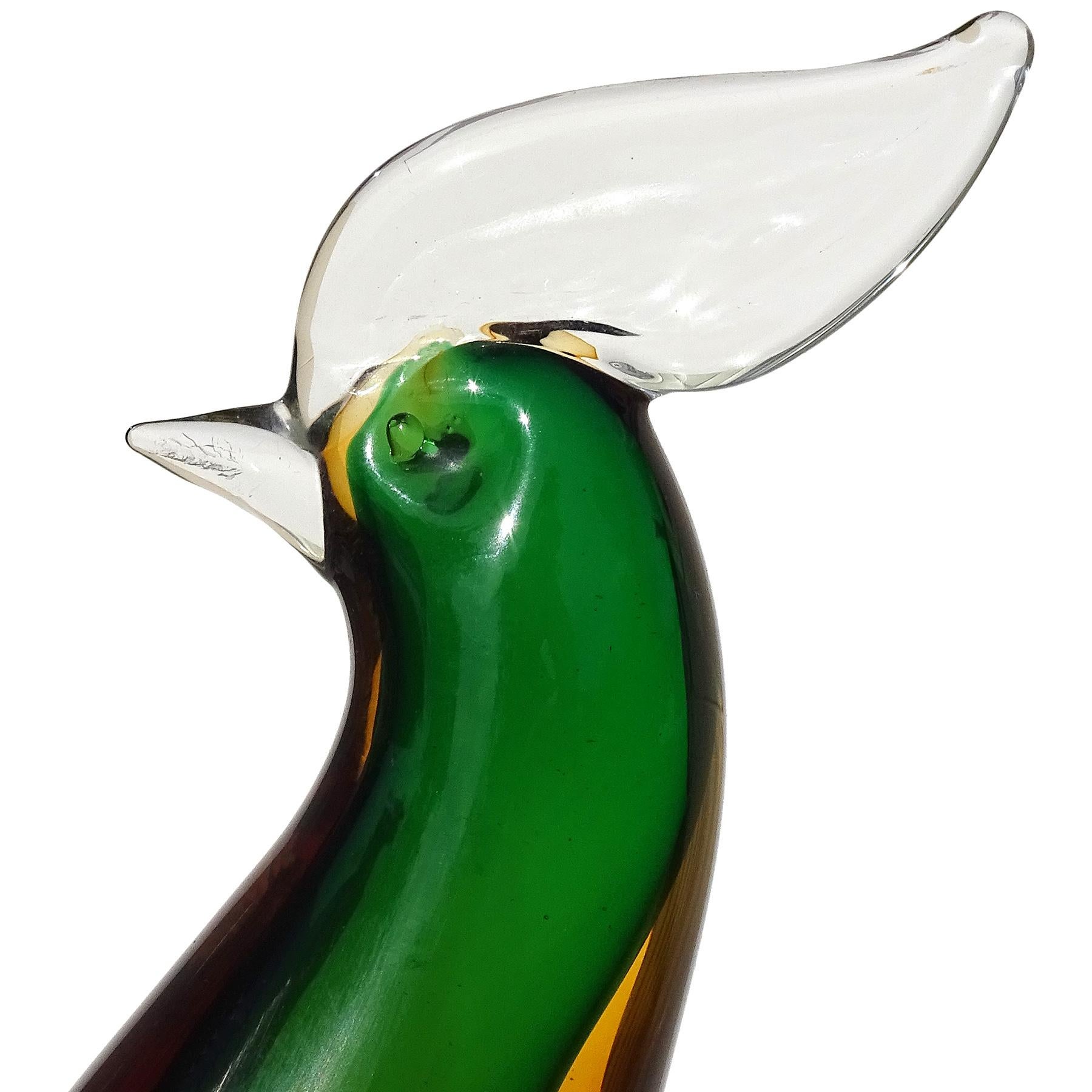 Beautiful vintage Murano hand blown Summerso orange, green and gold flecks Italian art glass bird sculpture. Created in the manner of designer Alfredo Barbini. The pheasant, or rooster, stands tall with clear crest and beak, elegant body, curled