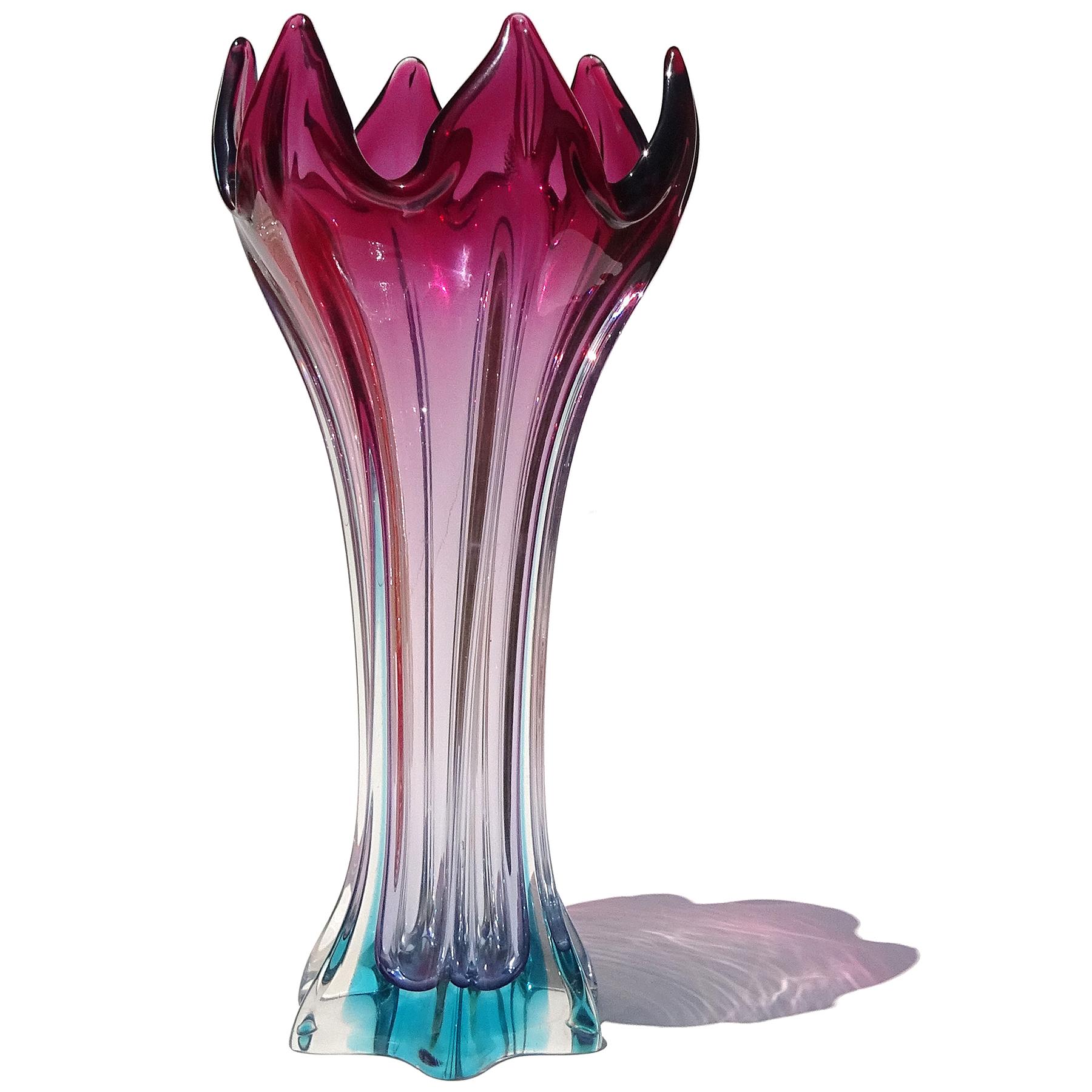 Beautiful vintage Murano hand blown Sommerso purple to light blue Italian art glass abstract shape flower vase. The piece has a unique shape with the open top of the vase looking like an open flower (specially from the top down). It has a ribbed