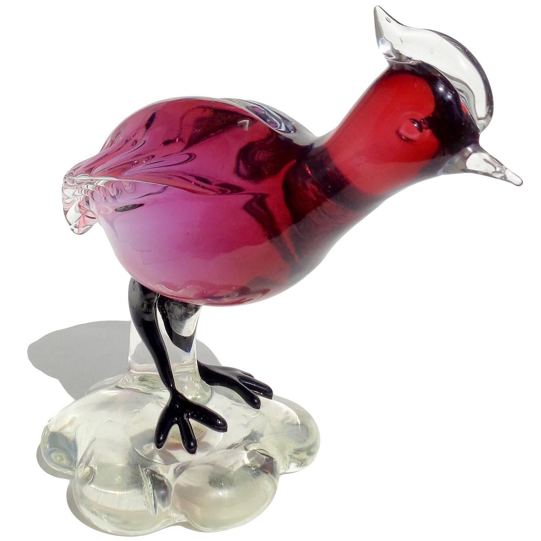 Beautiful vintage Murano hand blown Sommerso red amethyst Italian art glass guinea or quail bird sculpture. The piece is attributed to the Salviati company, with Alfredo Barbini the likely designer. The bird a red color which fades from the head,