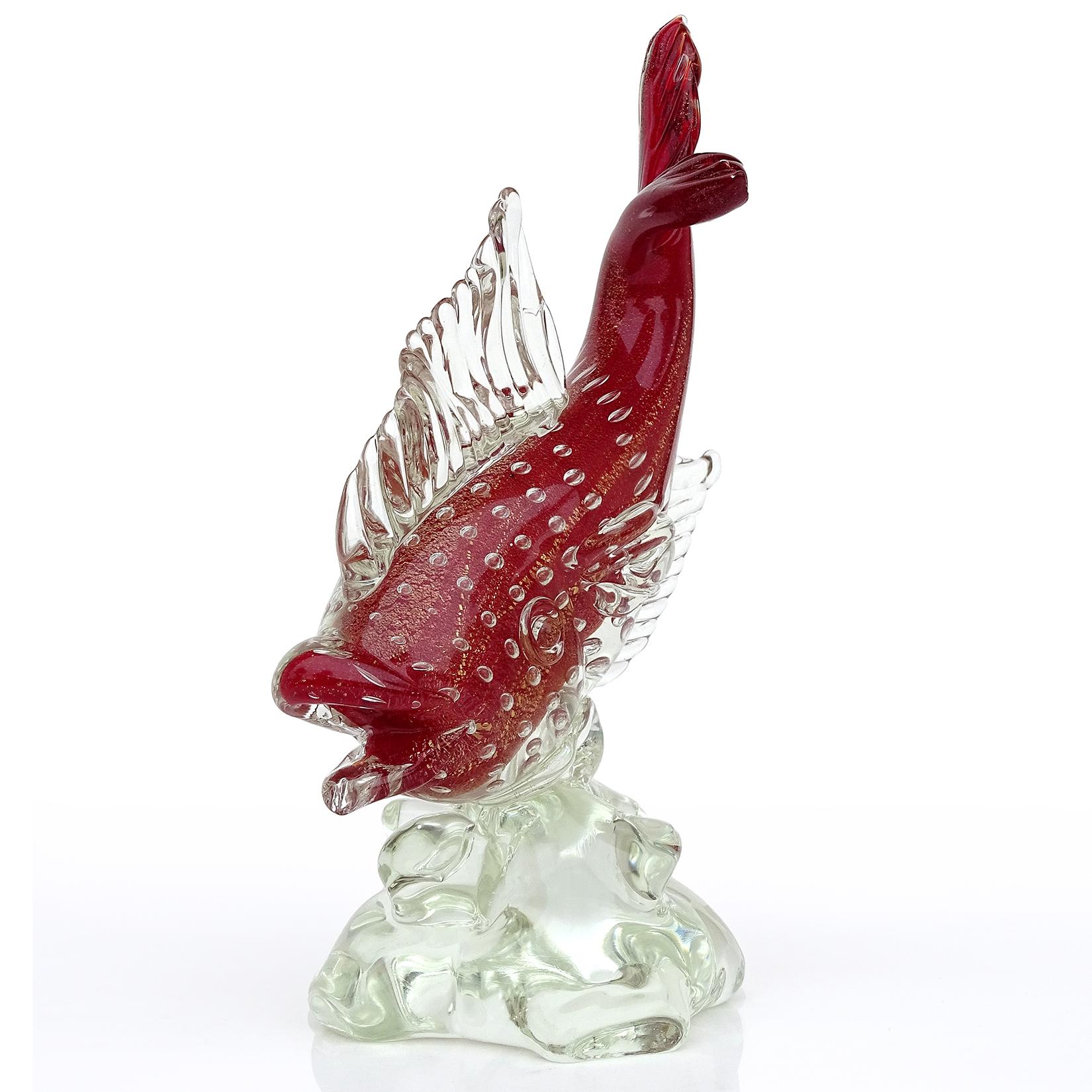 Beautiful, antique, early Murano hand blown Sommerso red, controlled bubbles and gold leaf Italian art glass fish sculpture on clear base. Created in the manner of designer Flavio Poli for the Seguso Vetri D' Arte company. The piece was created in