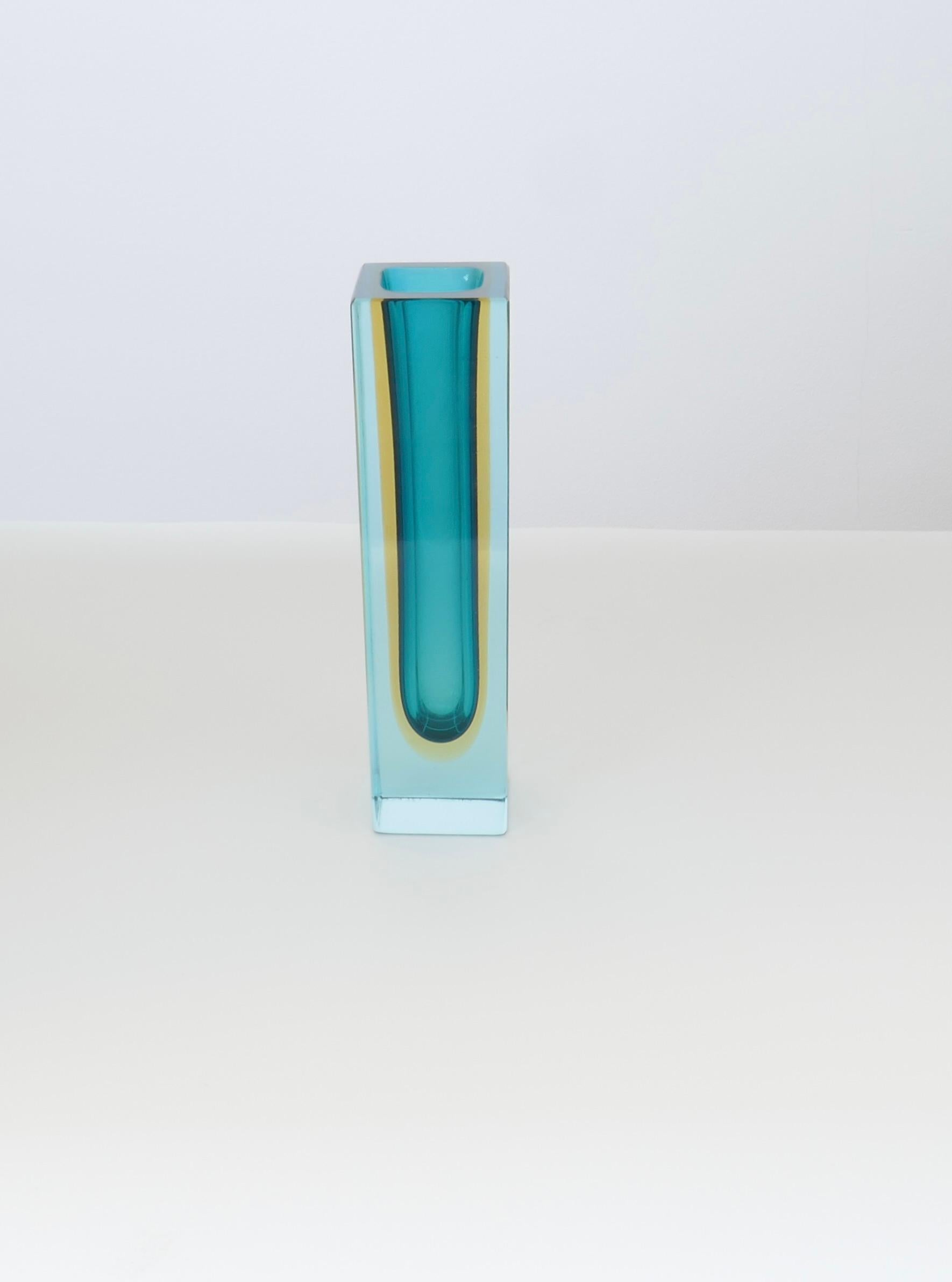 Soliflore Sommerso ( blue , amber, clear) Vase signed by Flavio Poli and dated 1961. 
Italian glass artist Flavio Poli (1900-1980) is praised for his contribution to the development of Murano glass , championing a new style during the 1950s known