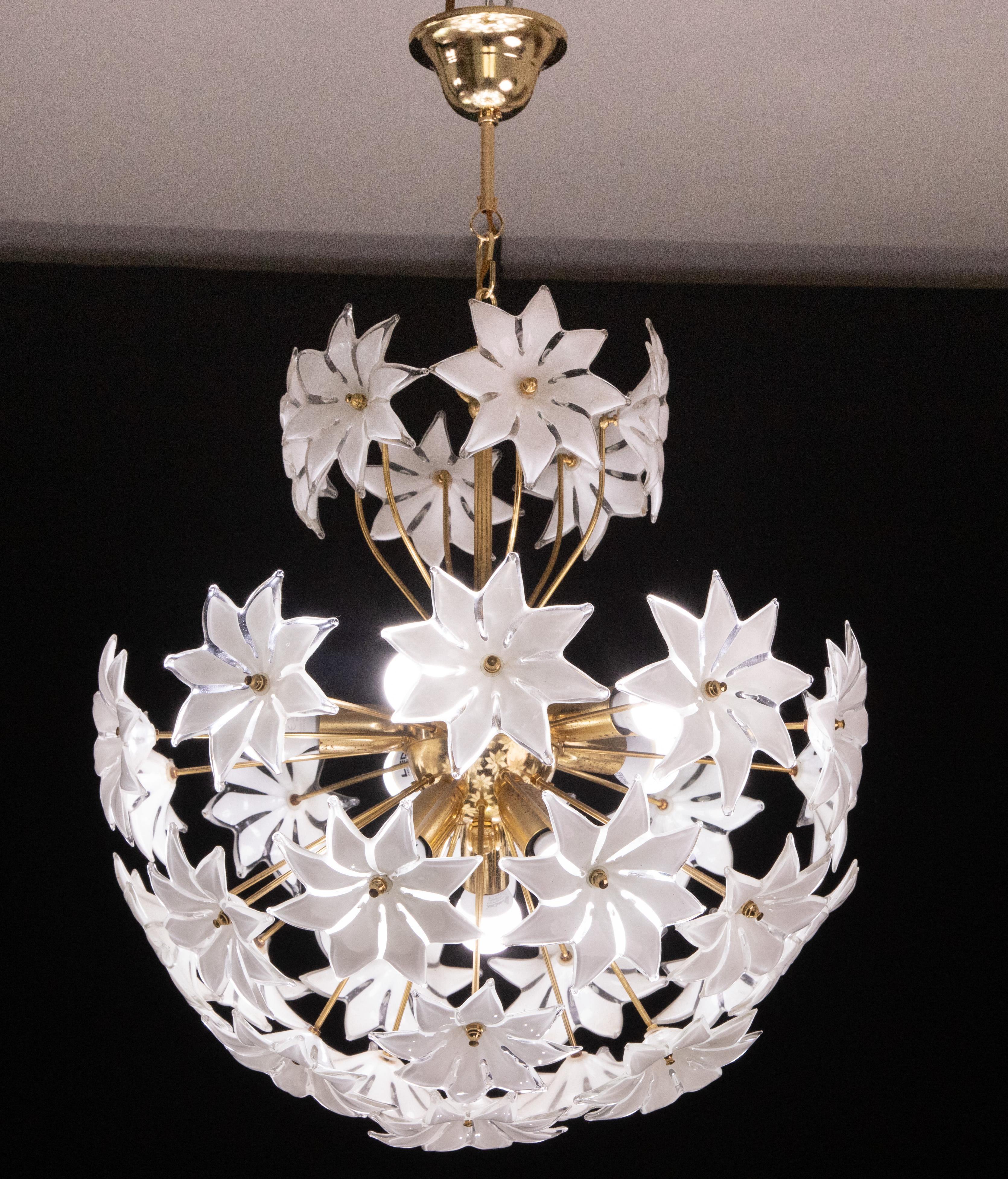 Vintage Murano glass chandelier with glass flowers.
Gold bath frame, some small signs of time that gives authenticity and charm.
The chandelier has 10 light points with E14 socket.
The height of the chandelier is 85 cm, the width of the