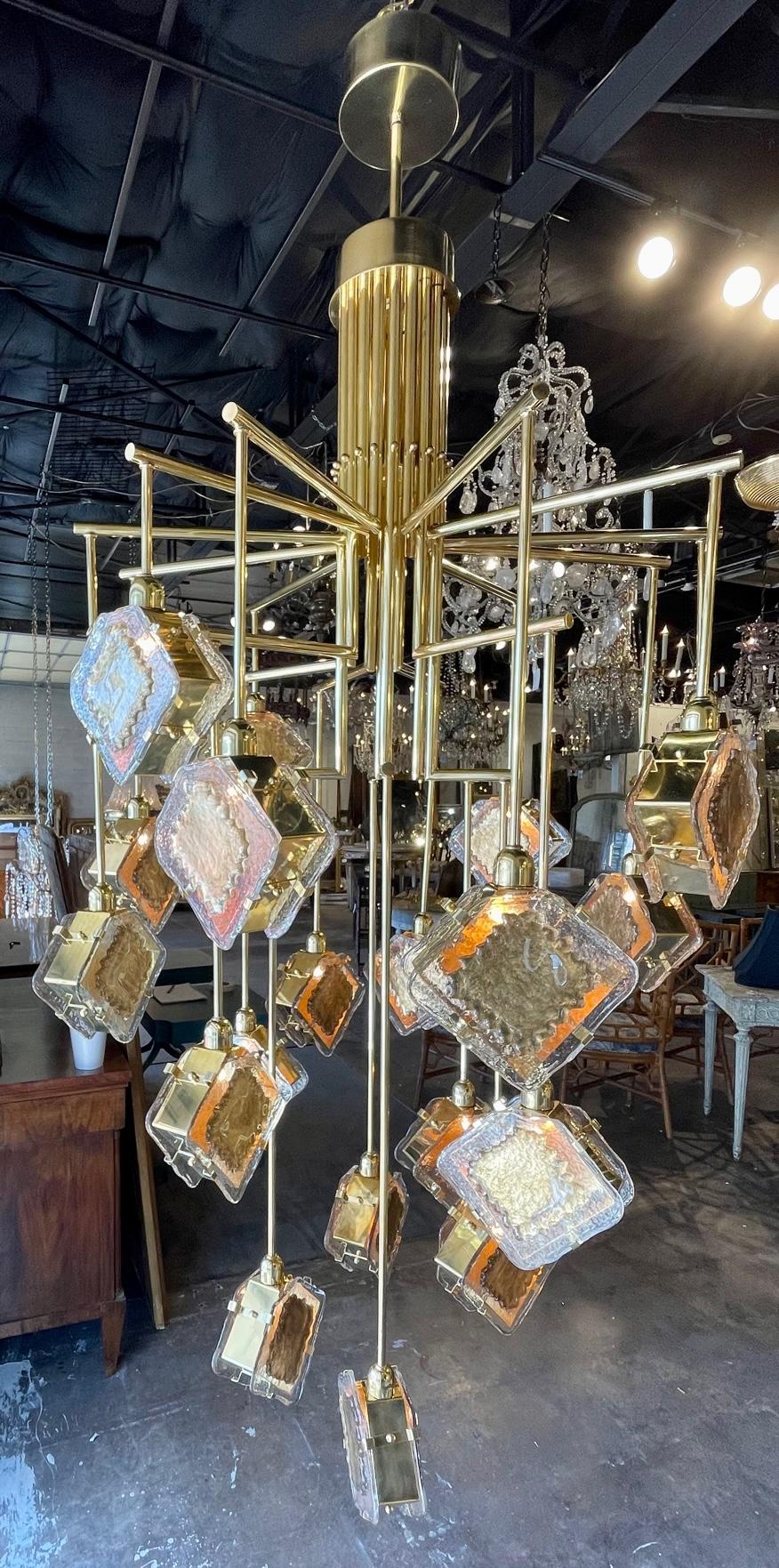 Modern large scale Murano glass and brass suspension chandelier. Circa 2000. The chandelier has been professionally re-wired, cleaned and is ready to hang. Includes matching chain and canopy.