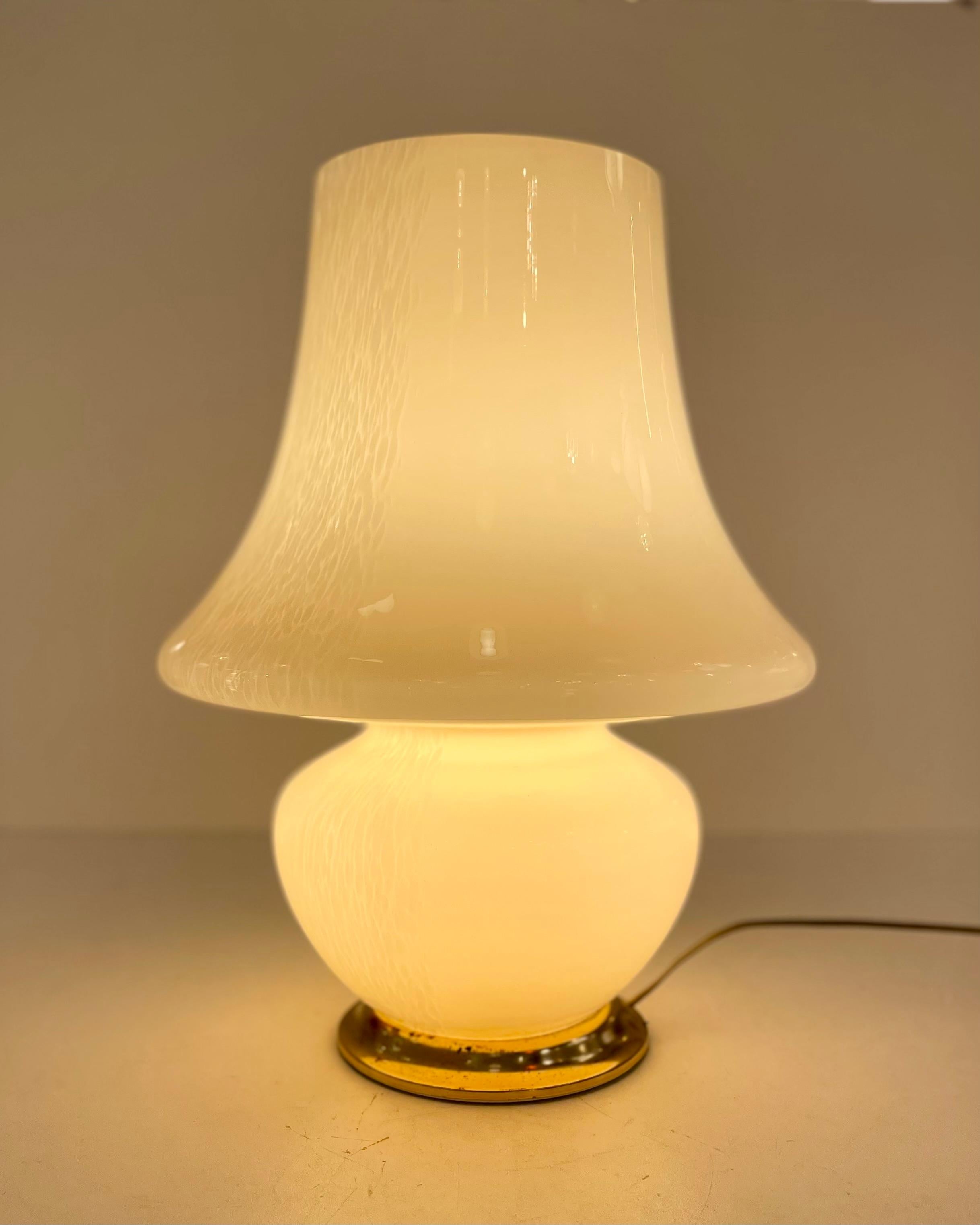 Italian mushroom table lamp in blown Murano glass with a molten speckle effect and a golden metal base, from the late 1970’s, early 1980’s.
-
Produced in: Murano, Venice, Italy
Design period: 1970’s ~ 80’s
Materials: Murano glass, metal
Color: