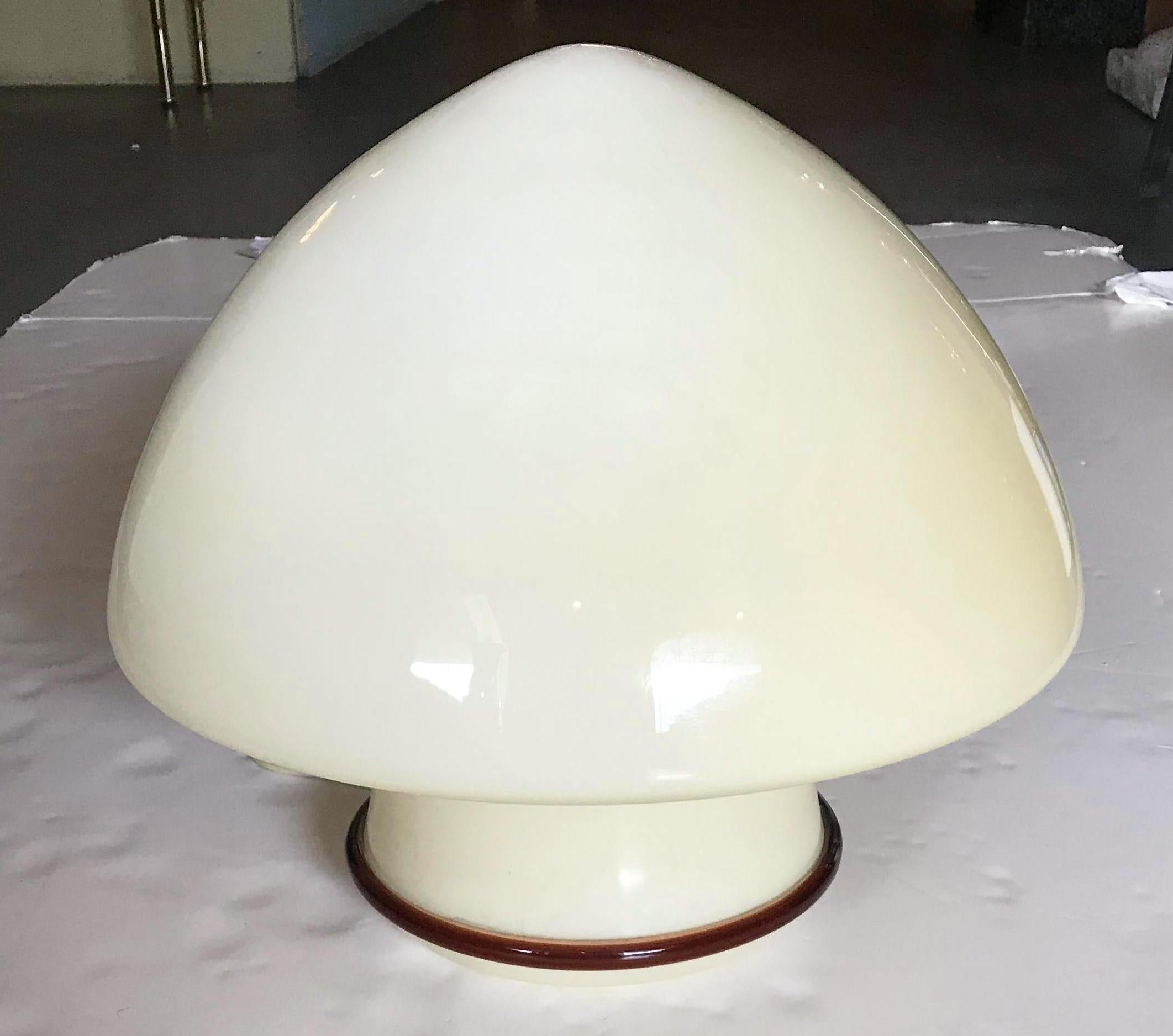 Vintage Italian cream colored Murano glass table lamp with a dark amber glass edge / Designed by De Majo circa 1960's / Made in Italy / Original label on the glass
1 light / E26 or E27 type / max 60W
Diameter: 16 inches / Height: 15 inches
1 in