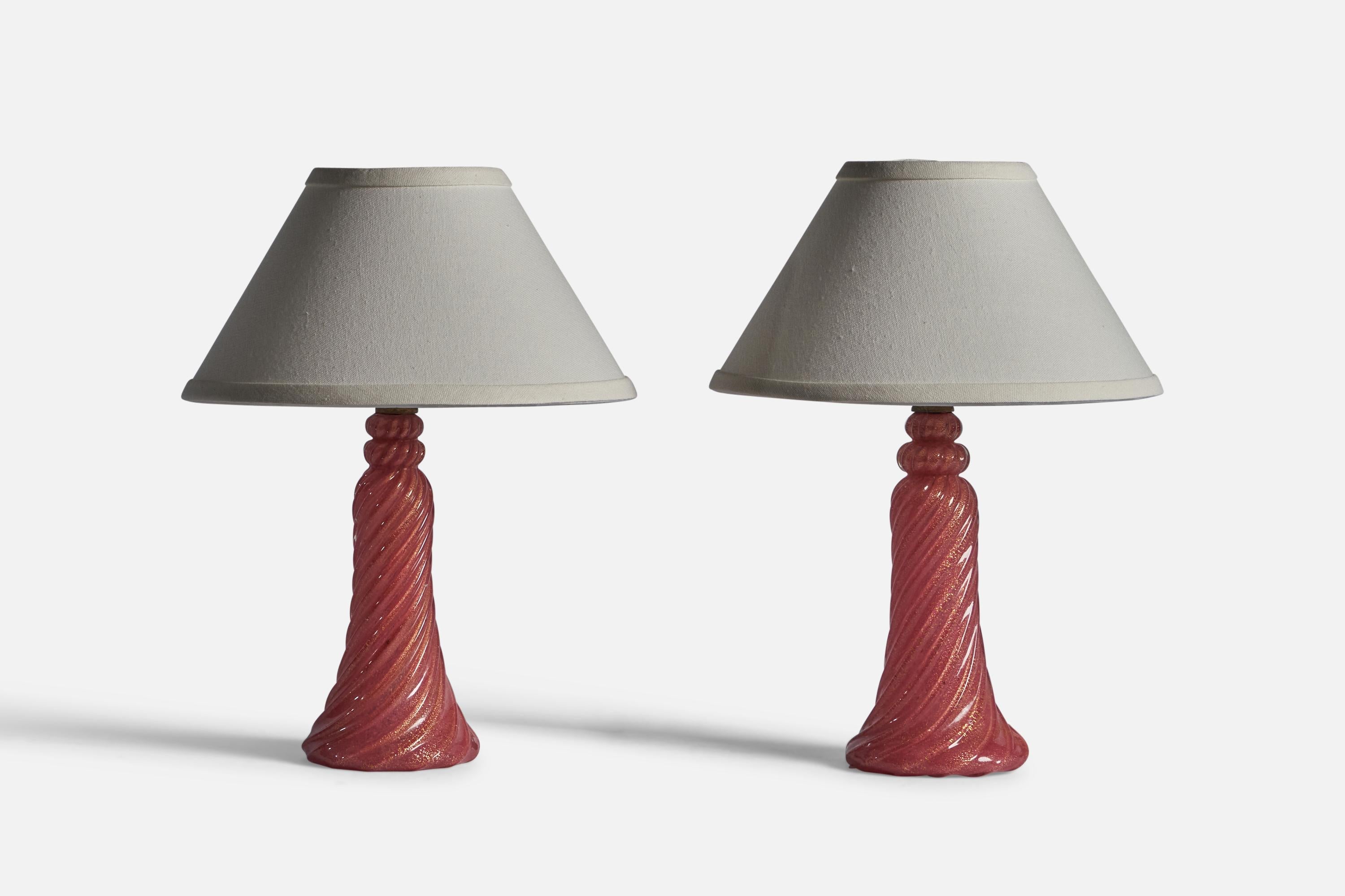 A pair of pink glass and brass table lamps, designed and produced in Murano, Italy, c. 1940s.

Dimensions of Lamp (inches): 14