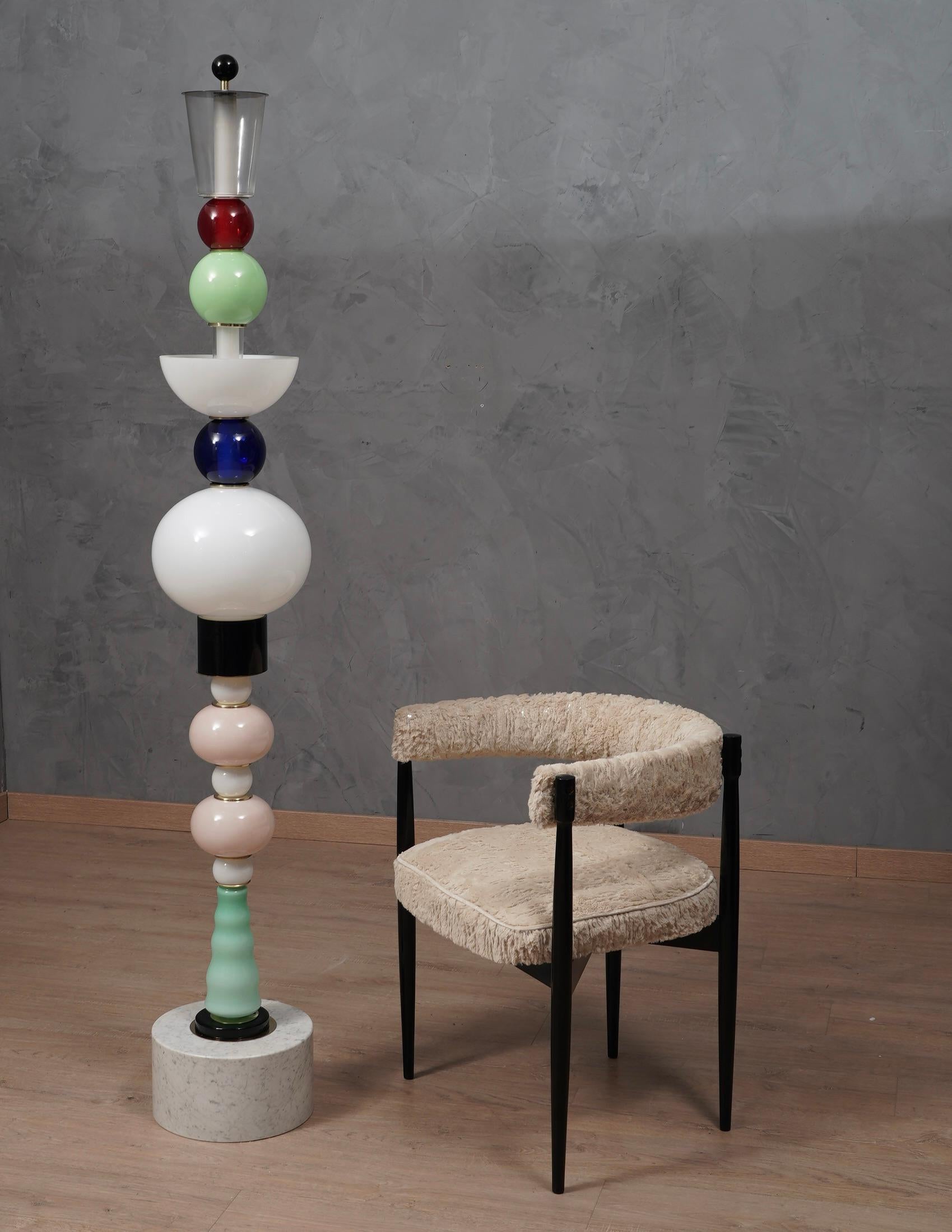 Very particular Totem in Murano glass, crazy design for a glass and marble floor lamp. The Totem is one of a kind.

The floor lamp is composed of a base in Carrara marble, with a diameter of about 29 centimeters ( 11 Inches ) and a height of 20