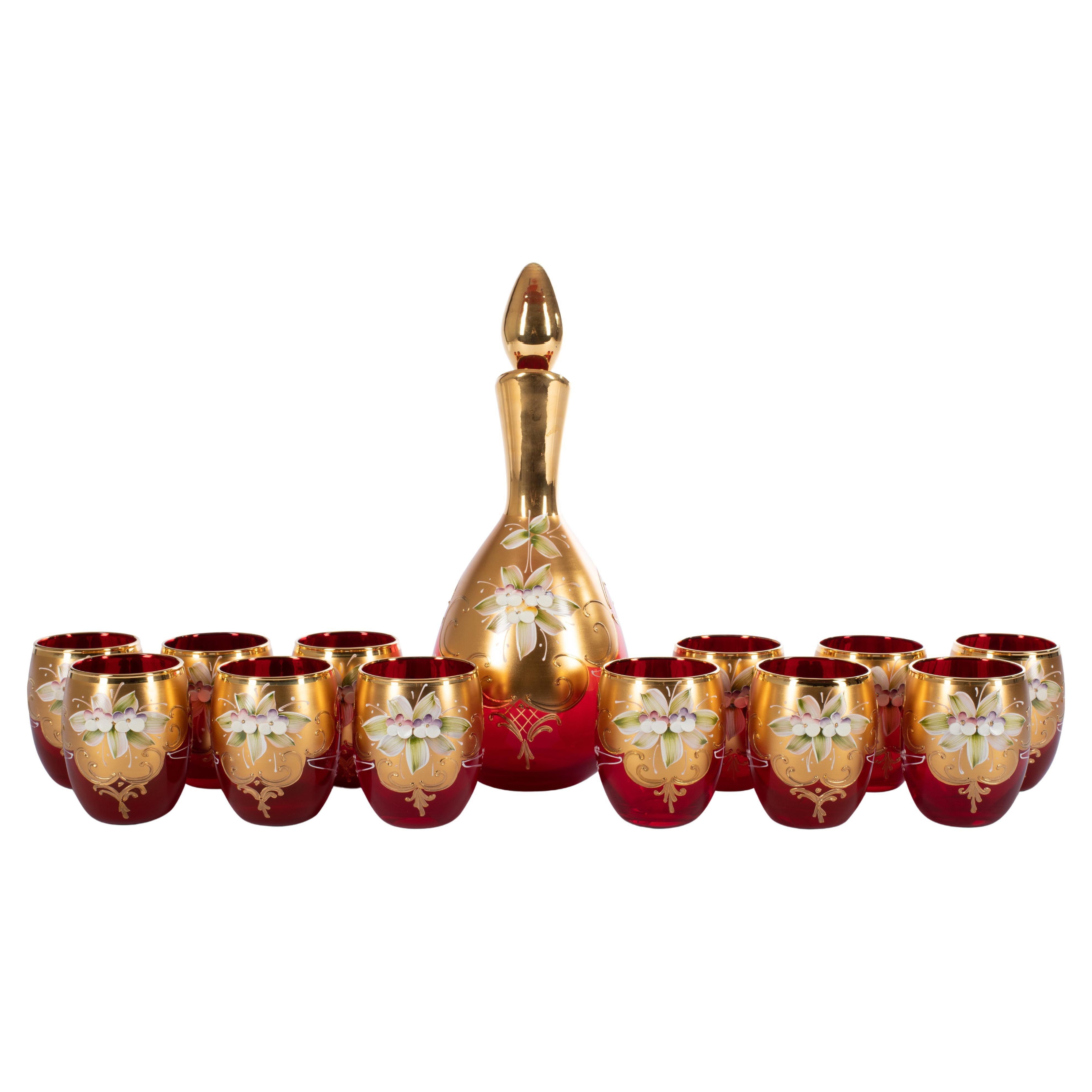 1295 Murano is proposing this beautiful hand made TRE FUOCHI Collection of 
12 tumblers 
2 bottles,
Venice hand blown ruby red glass, and hand made Fire Enamel decors on a 24kt gold hand made decors.
Fully hand made in Venice, Murano, Italy.
These