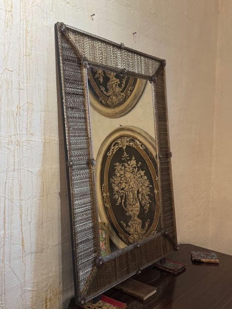 Gorgeous modern Murano twist glass rod mirror in Fume' Color. You're drawn to a sleek fusion of mid-century modern glamour and Italian craftsmanship—Milo Baughman–style burl wood and polished brass consoles are sculptural statement pieces that