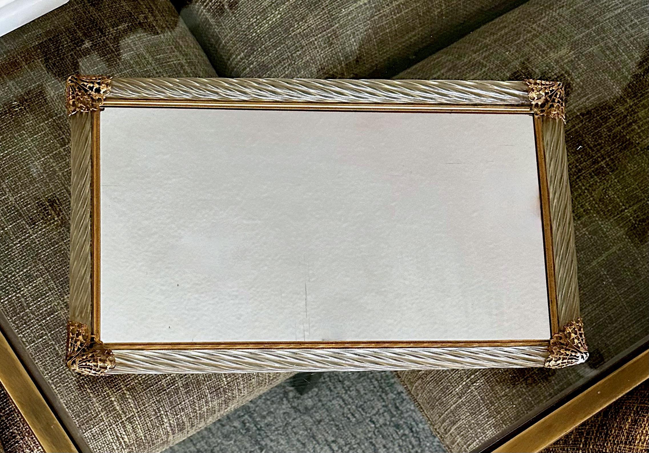 Murano Venetian glass mirrored vanity tray surmounted by twisted blown glass with finely detailed embossed brass straps and edging. 