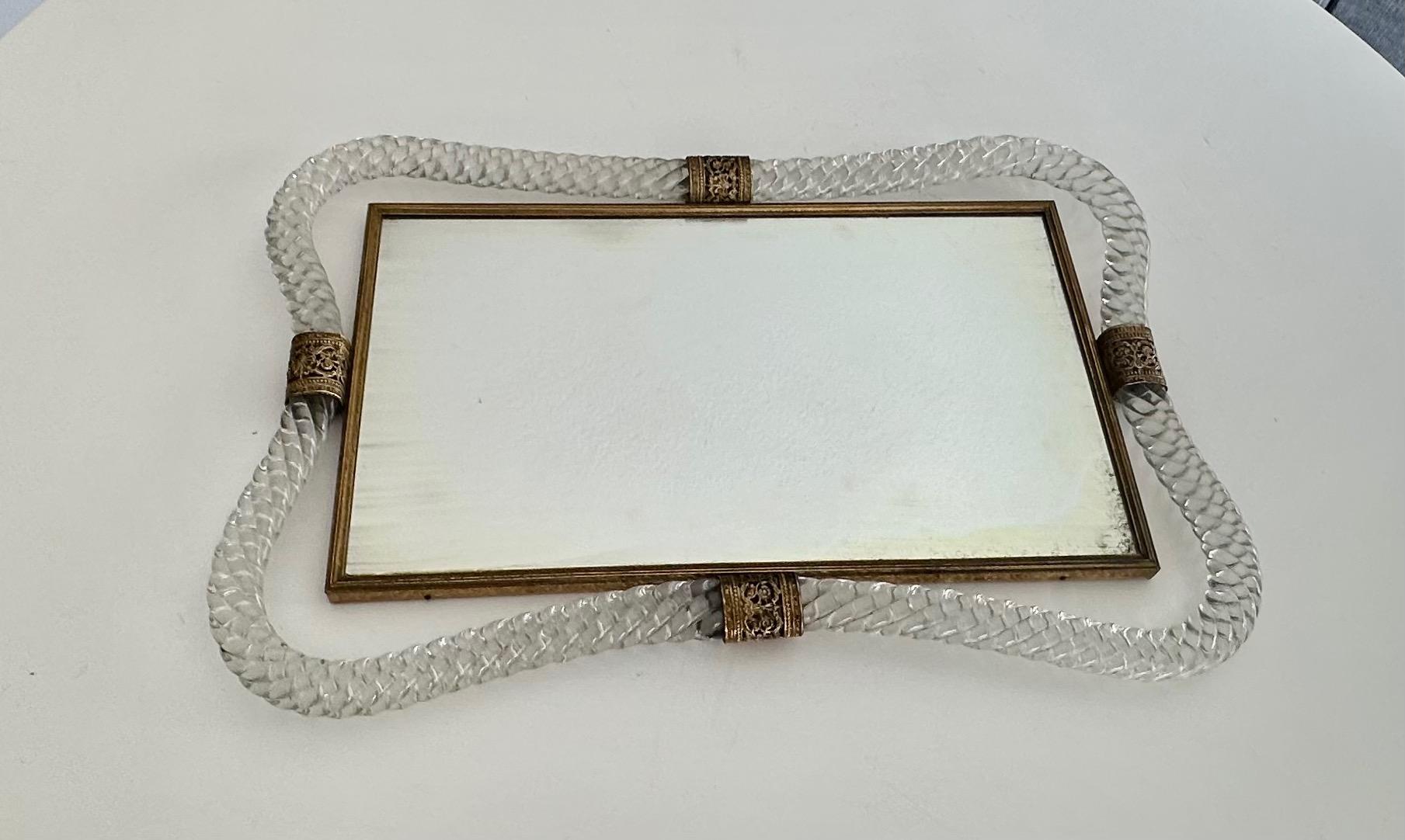 Murano Venetian glass mirrored vanity tray surmounted by twisted blown glass with finely detailed embossed brass straps and edging. 