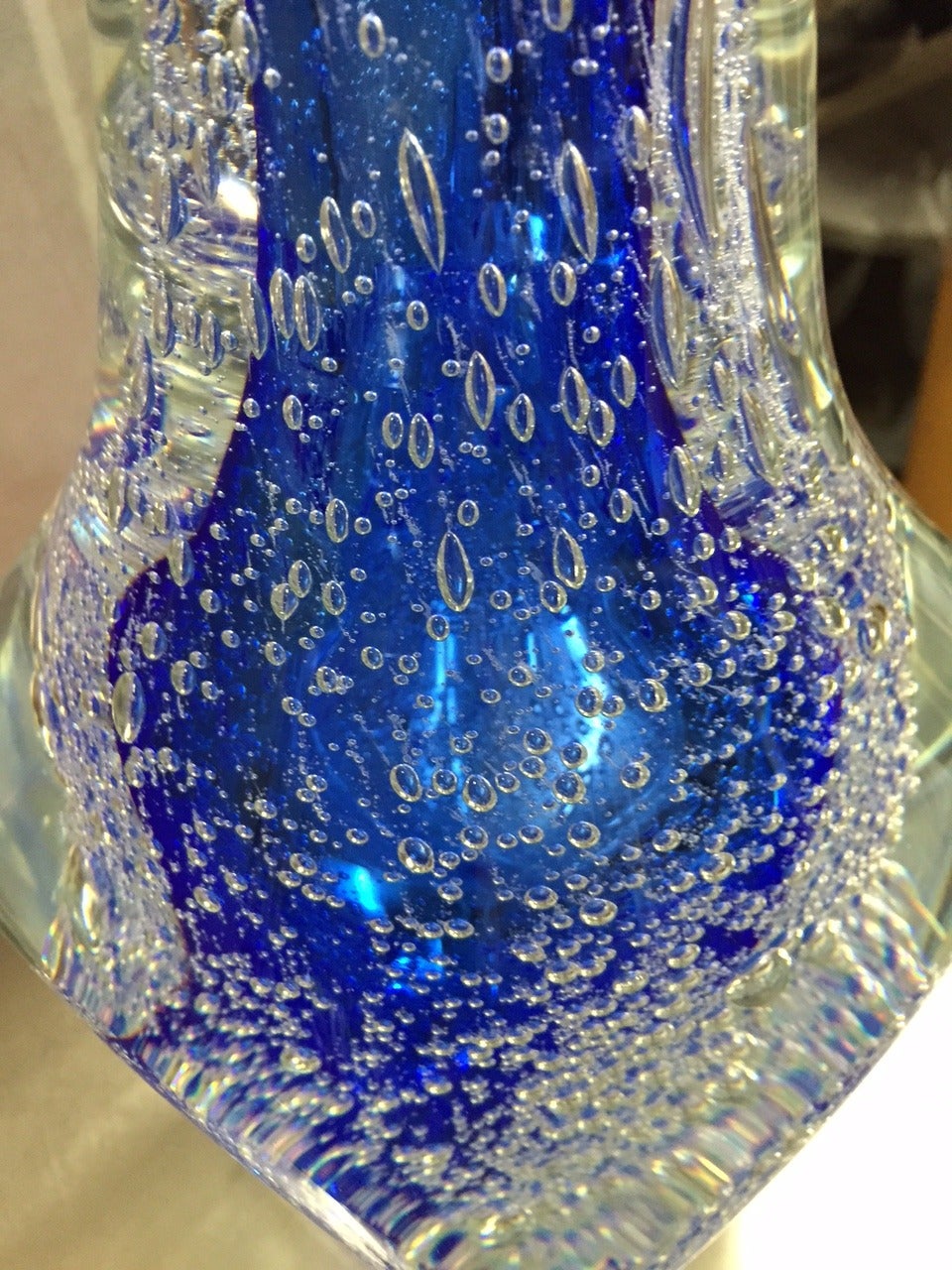 Heavy quality Murano vase. Stunning blue color to the center.