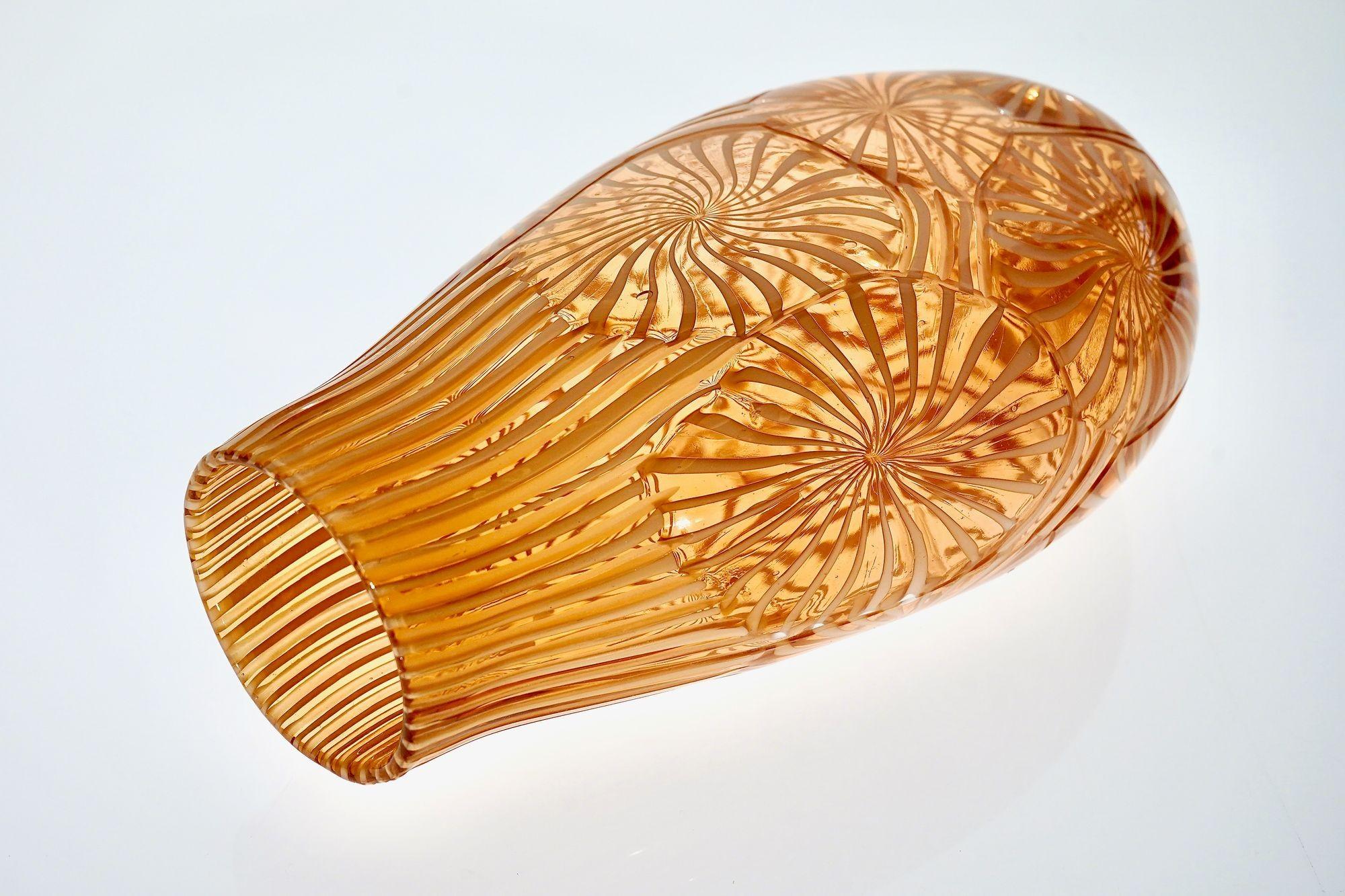 Vase made using the stellato technique. The Maestro produced both the stellato murrine and the filigree specifically for this work. The rose and white filigree was created and hand-pulled in the furnace, as this type of cane is not commercially