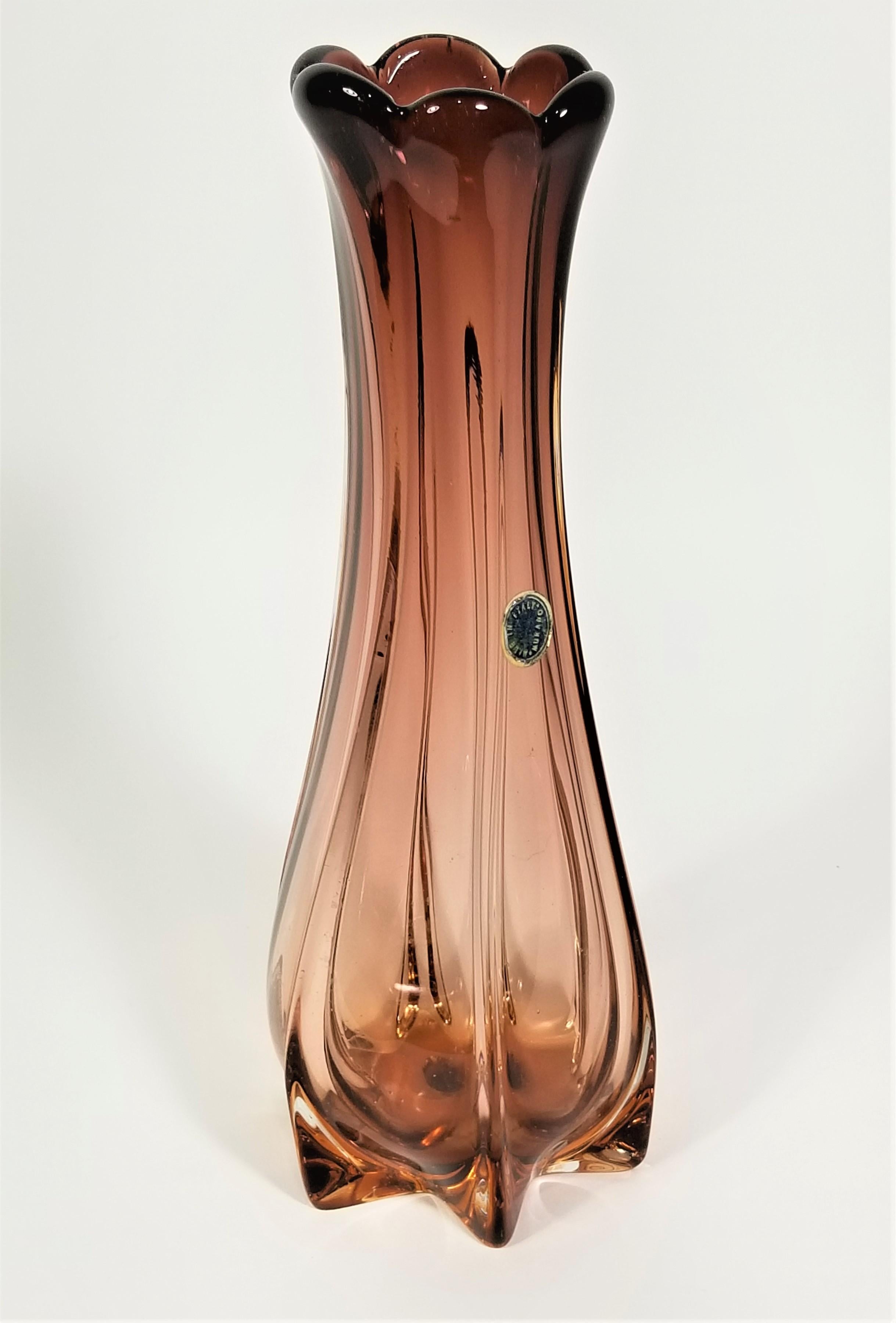 Mid century 1950s 1960s Murano hand blown art glass vase. Beautiful rose color. Still retains original Murano marking sticker. Made in Italy. 

Measurements:
Vase height: 9.5 inches
Vase diameter Top: 2.5 inches
Vase diameter Bottom: 3.5