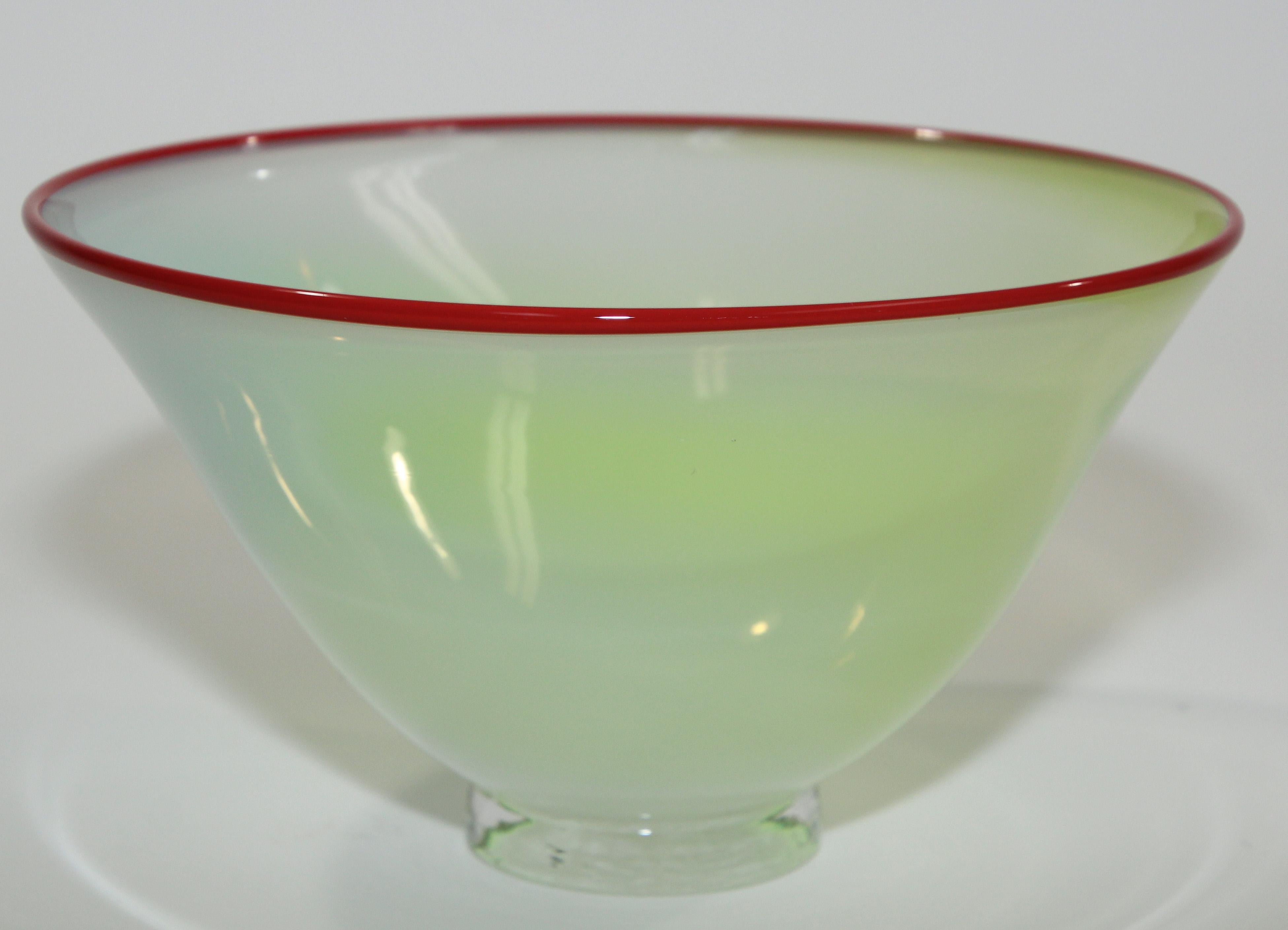 Beautiful mid-20th century Italian murano Venetian hand blown art glass footed bowl
Fabulous bowl in jade color with red rim.
Beautiful decorative piece for any table or shelf, very delicate decorative bowl with bright modern colors.
Hand blown