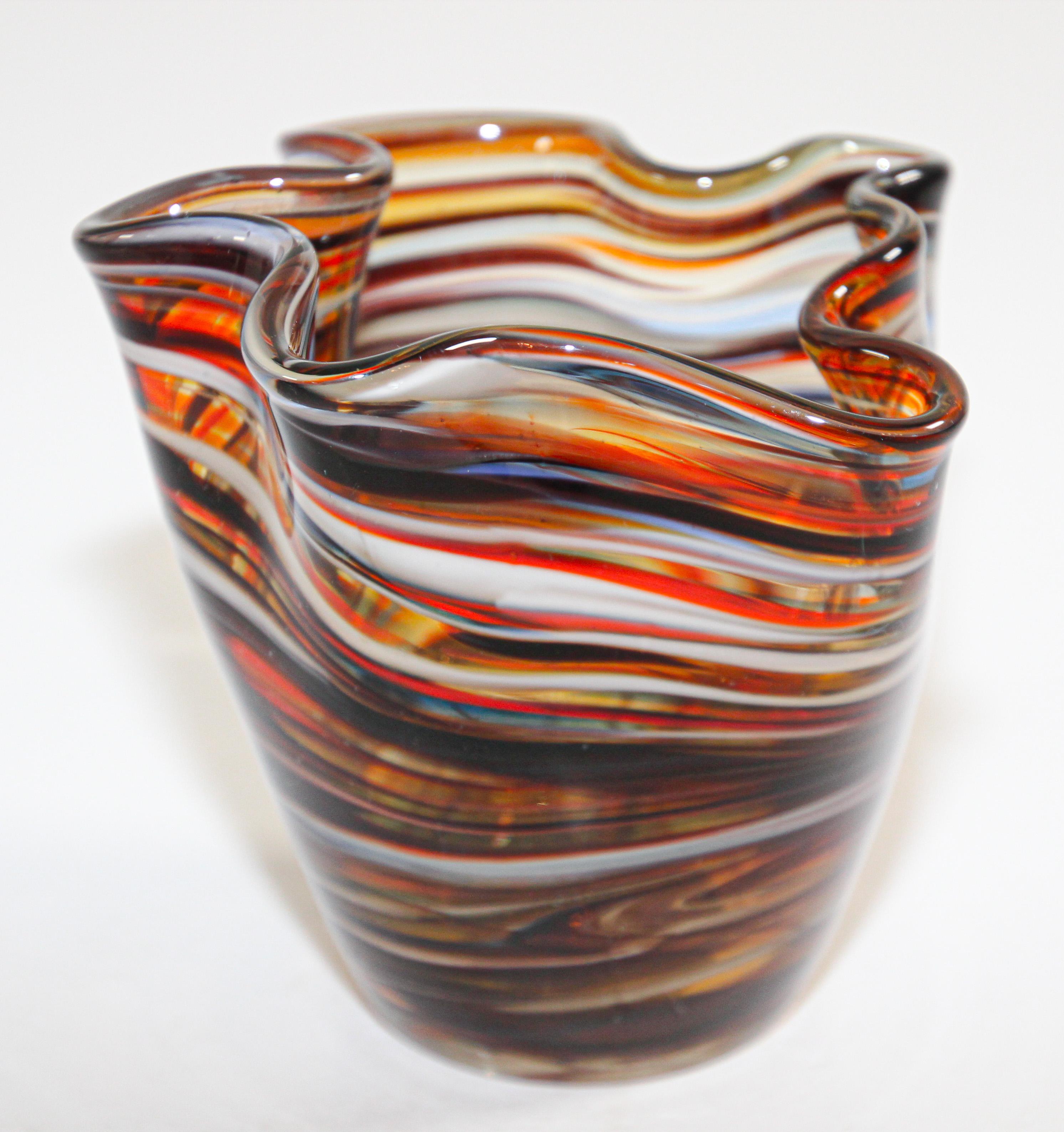 Mid-20th century Italian Murano Venetian hand blown brown art glass small vase.
Venetian or Murano glass Filigrana Fazzoletto or handkerchief vase.
Sculptural vase in organic form with rainbow colors.
Beautiful decorative piece for any table,