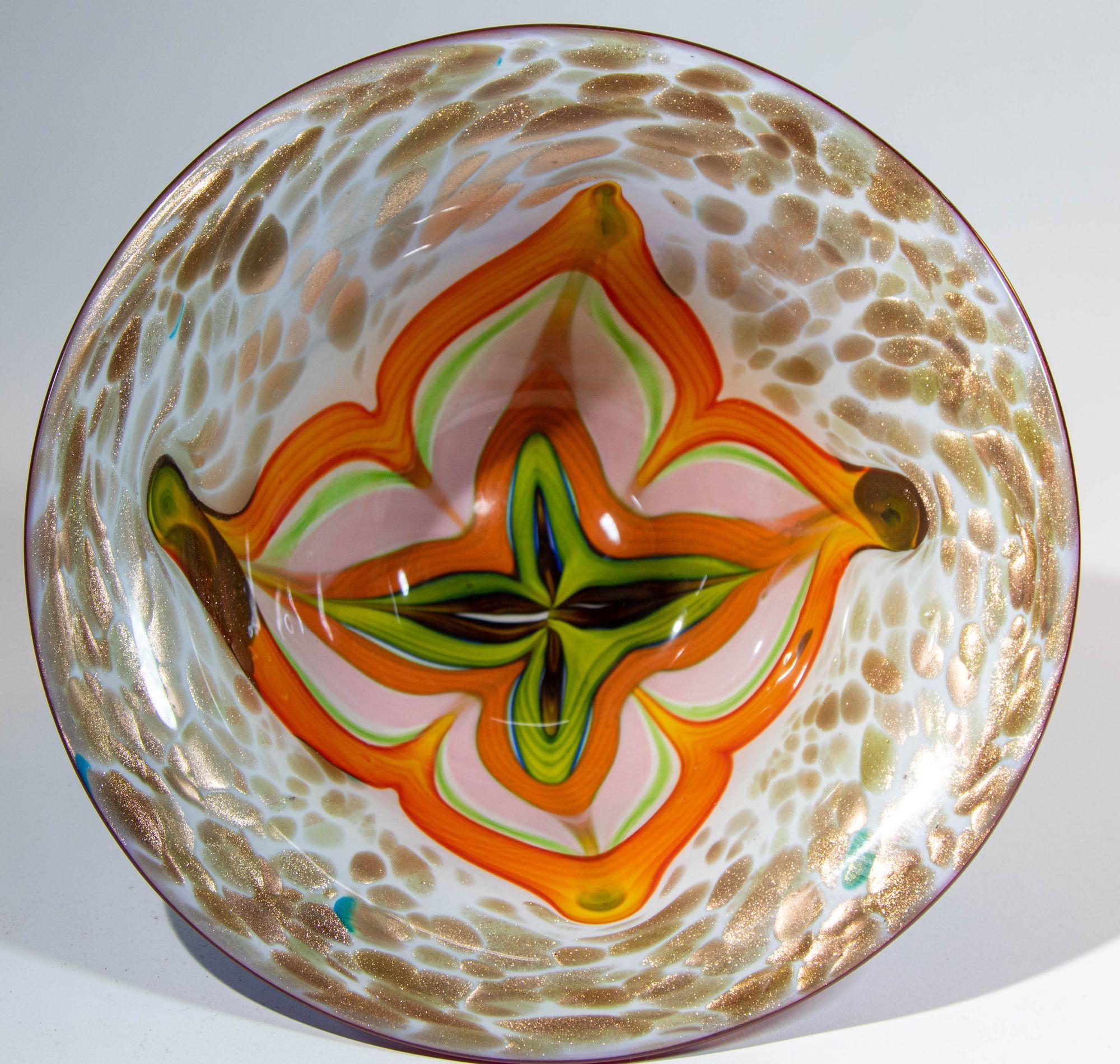 Beautiful mid-20th century Italian Murano Venetian hand blown art glass large bowl.
Fabulous large decorative blown glass bowl in bright colors with green and blue outside and orange, brown white gold with aventurine inside.
Beautiful hand crafted
