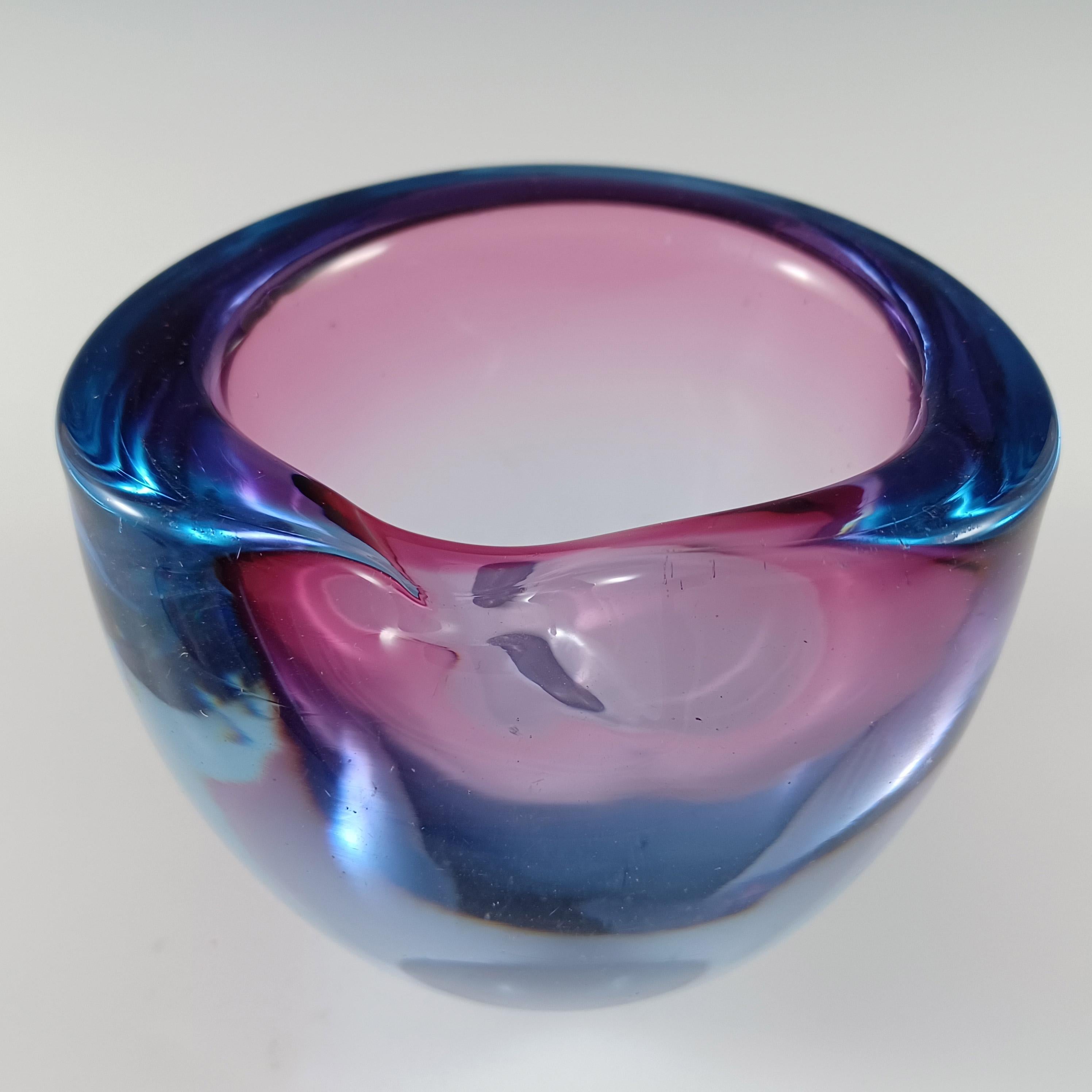 Here is a wonderful 1950/60's Venetian biomorphic glass posy vase or deep bowl, made on the island of Murano, near Venice, Italy. In a stunning combination of pink glass encased in blue glass.

Size
Measures approx 3.25 inches tall by 4 inches in