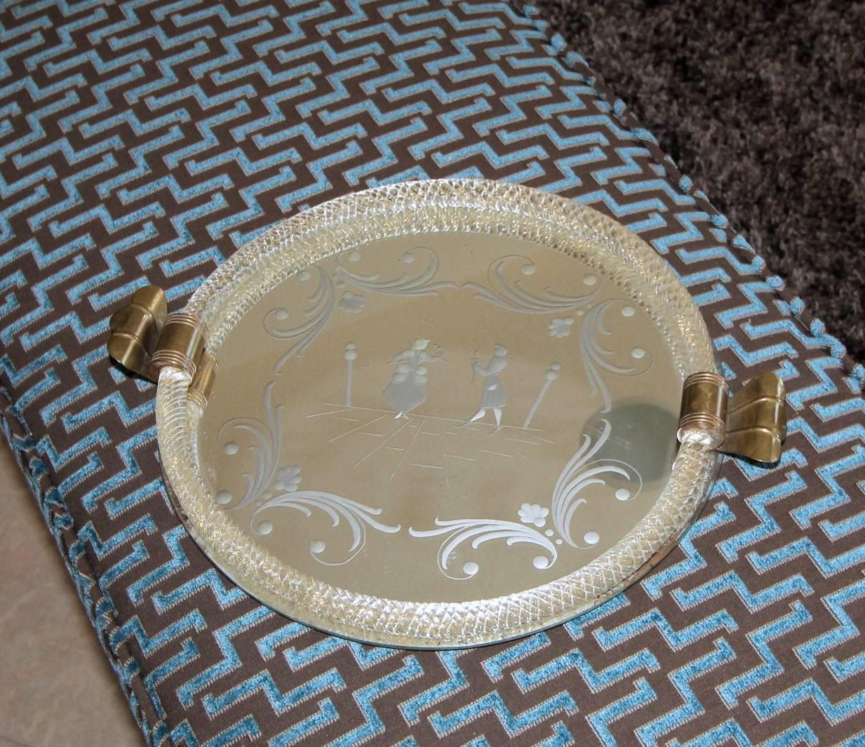 1940s Murano glass vanity tray etched on the reverse with a courting scene, textured glass rail with gold inclusions and brass patinated handles. Size of tray 12.5