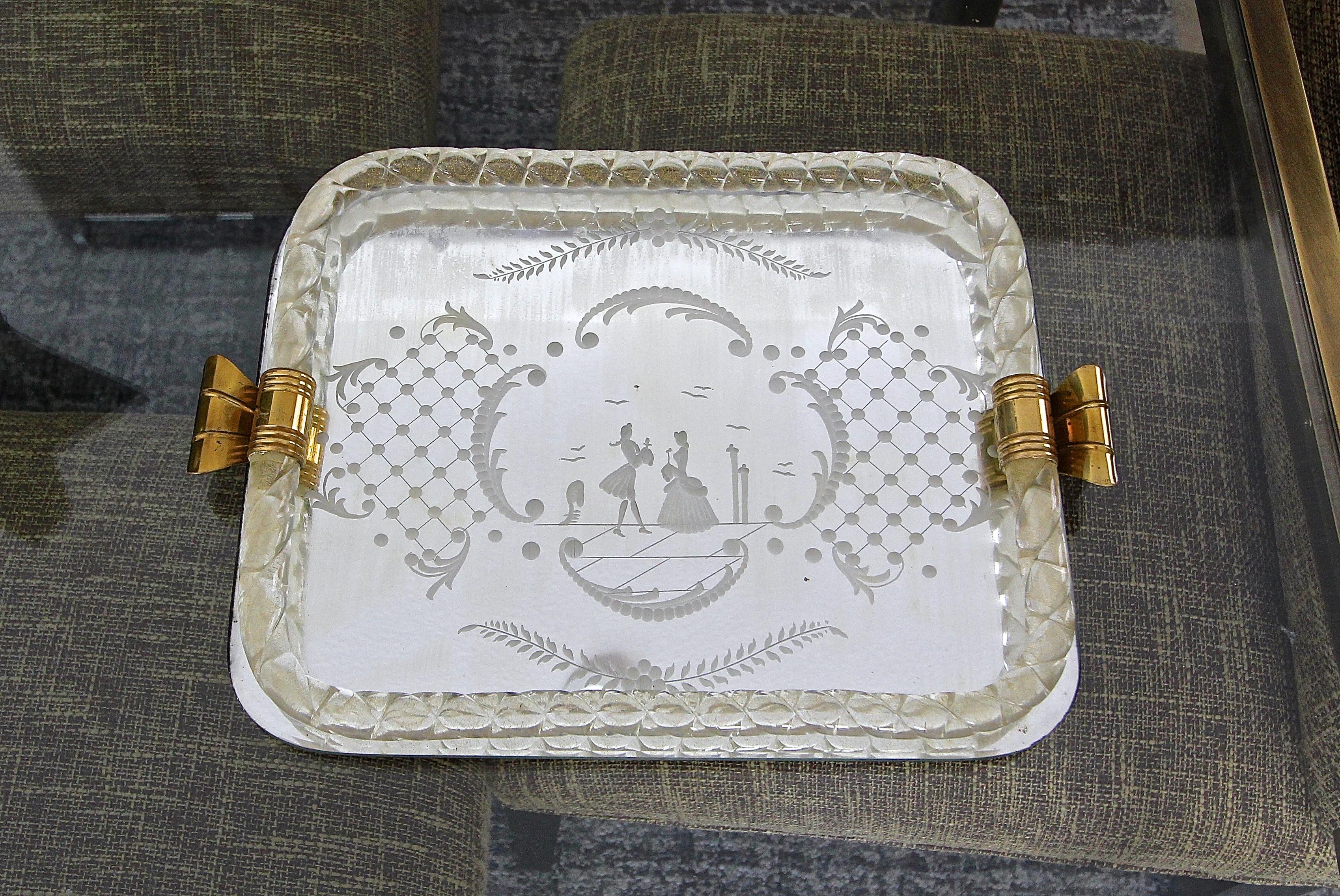Murano twisted clear and gold glass rope vanity tray with brass fittings. Mirrored glass has etched on the reverse with a courting scene motif. Tray size: 11.25