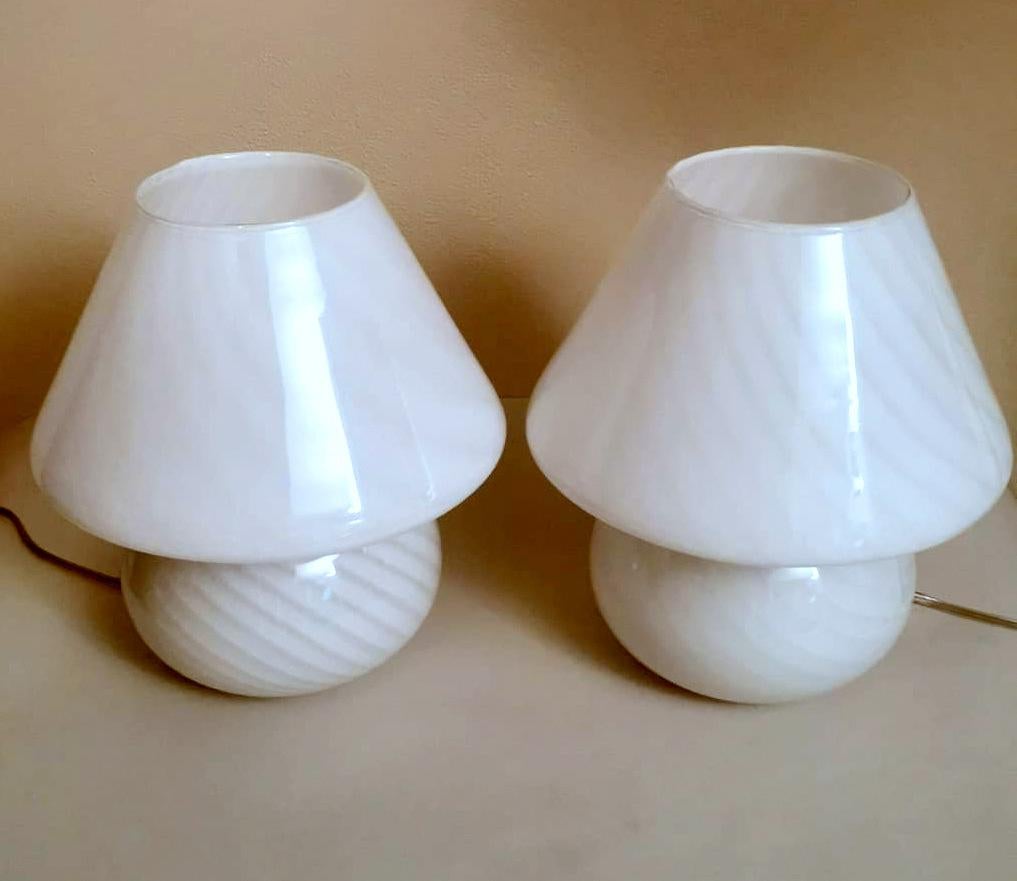 We kindly suggest you read the whole description, because with it we try to give you detailed technical and historical information to guarantee the authenticity of our objects.
Iconic pair of table or bedside lamps made of Murano opaline glass;