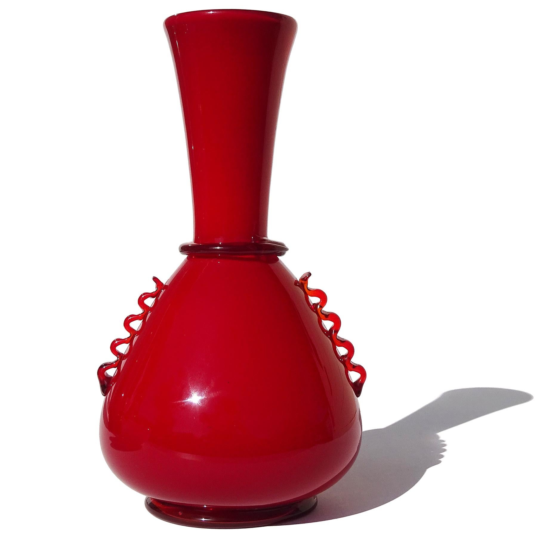 Beautiful, and rare, Murano hand blown rich ruby red layered Italian Art Deco glass flower vase. Created by Giuseppe Chiacigh, Italian painter and designer, for Vetrerie Artistiche Cirilo Maschio Glassworks. The glassworks was active between 1932