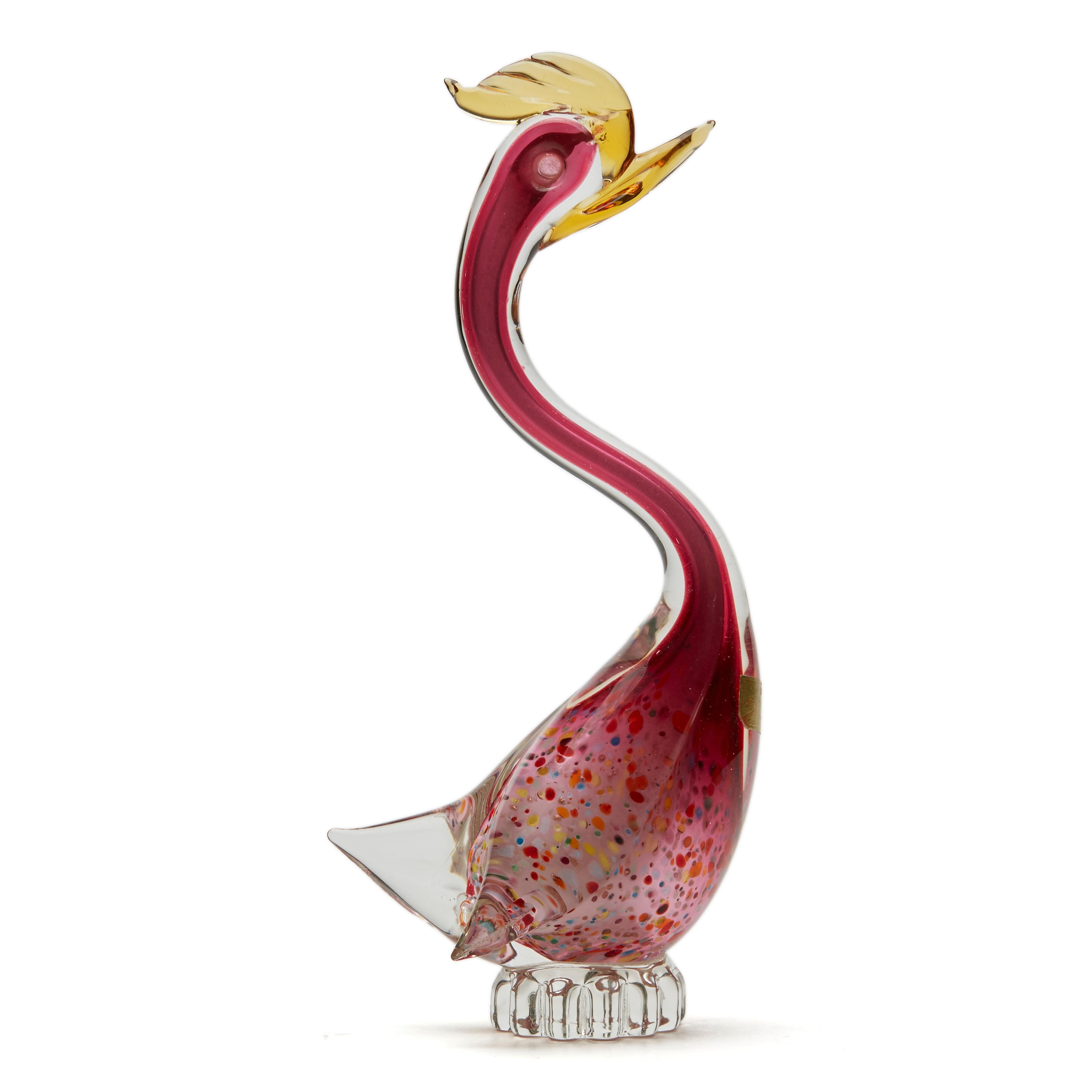 A fine and stylish vintage midcentury Italian, Murano cased glass bird with a speckled colour and aventrine pattern. The bird stands on a shaped narrow rounded clear glass base perch and has a long slender neck with a yellow glass crop and beak with