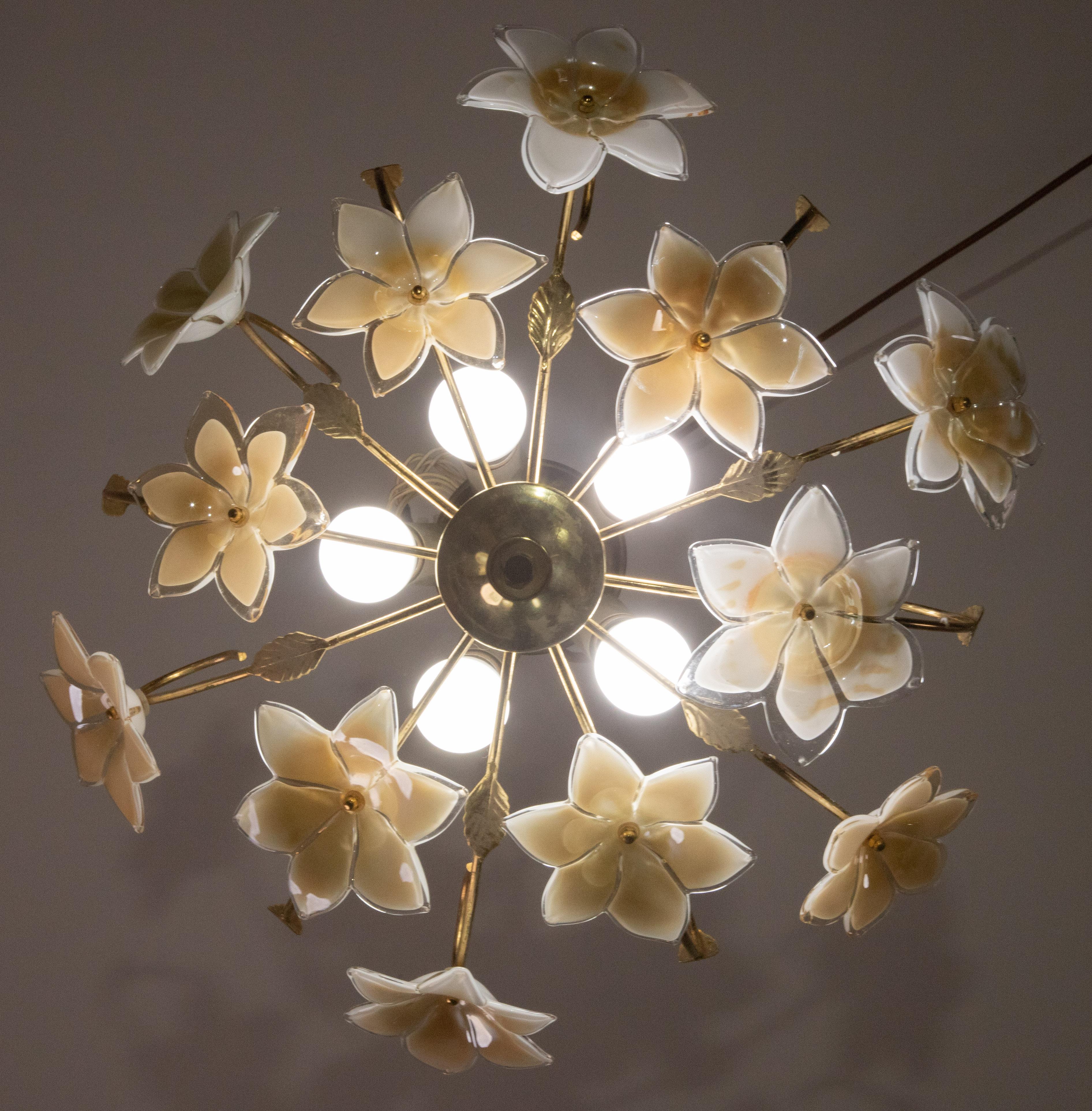 Gorgeous orange iridescent flowers Murano ceiling light.
The ceiling light mounts 5 lamp holders with E14 socket, posiblee to switch for USA.
Very good condition of the flowers, some signs of time on the structure.