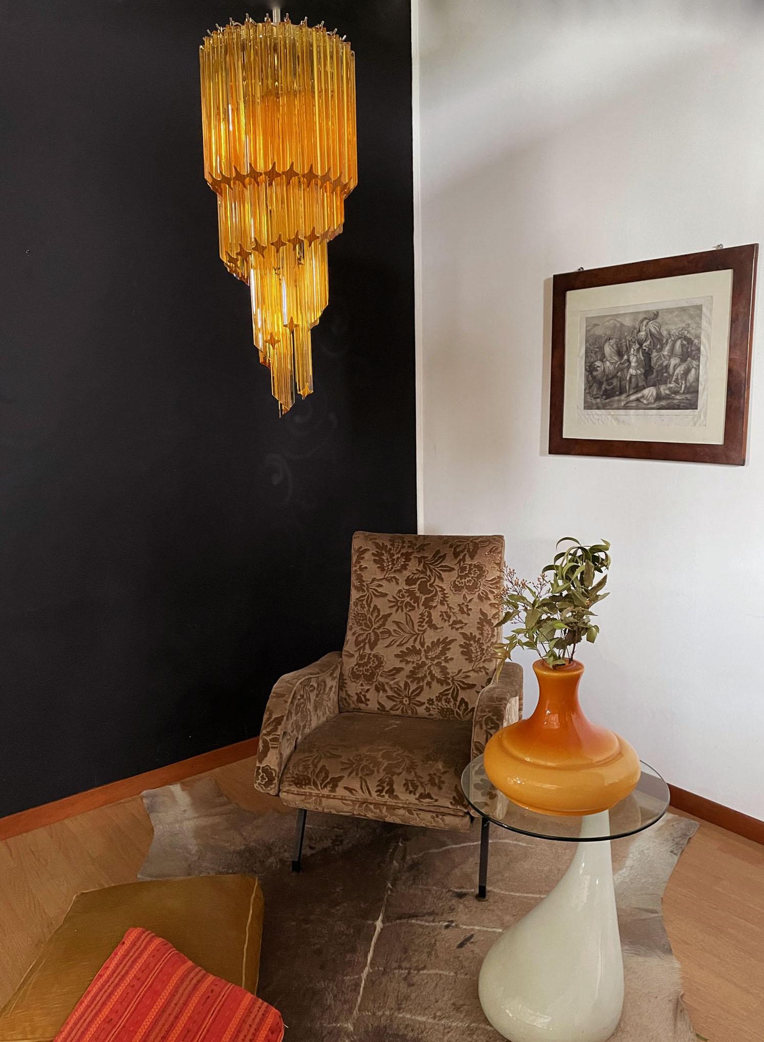 Fantastic and big Murano chandelier made by 54 Murano amber crystal prism (quadriedri) in a chrome metal frame. The shape of this chandelier is spiral.
Period: 1980s-1990s
Dimensions: 61 inches height (155 cm) with chain; 33.50 inches height (85