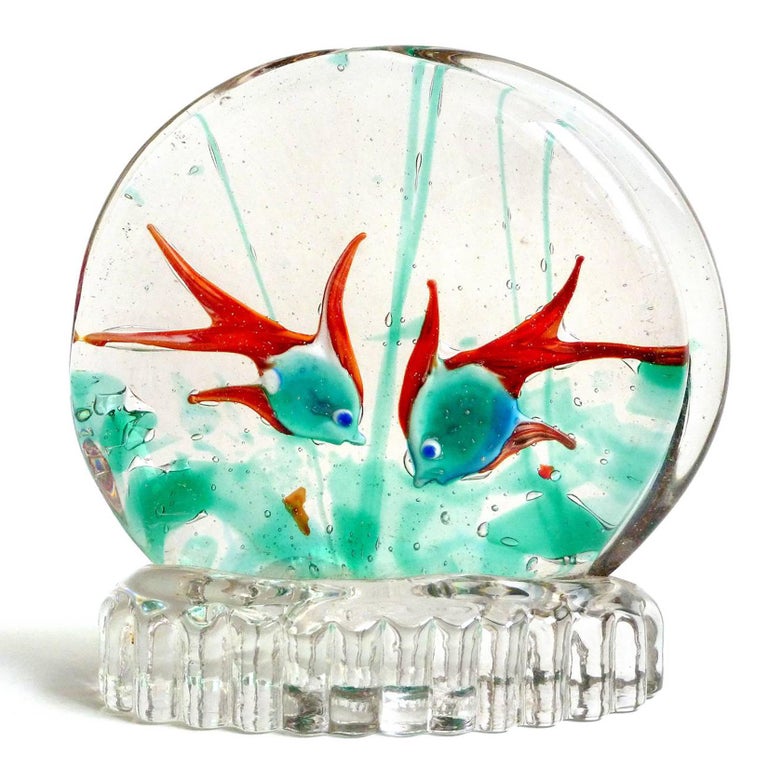 Beautiful vintage Murano hand blown two fish aquarium, with blue on front and green on back Italian art glass sculpture. Created in the manner of designer Riccardo Licata. The fish are sandwiched in glass layers, along with pieces of color