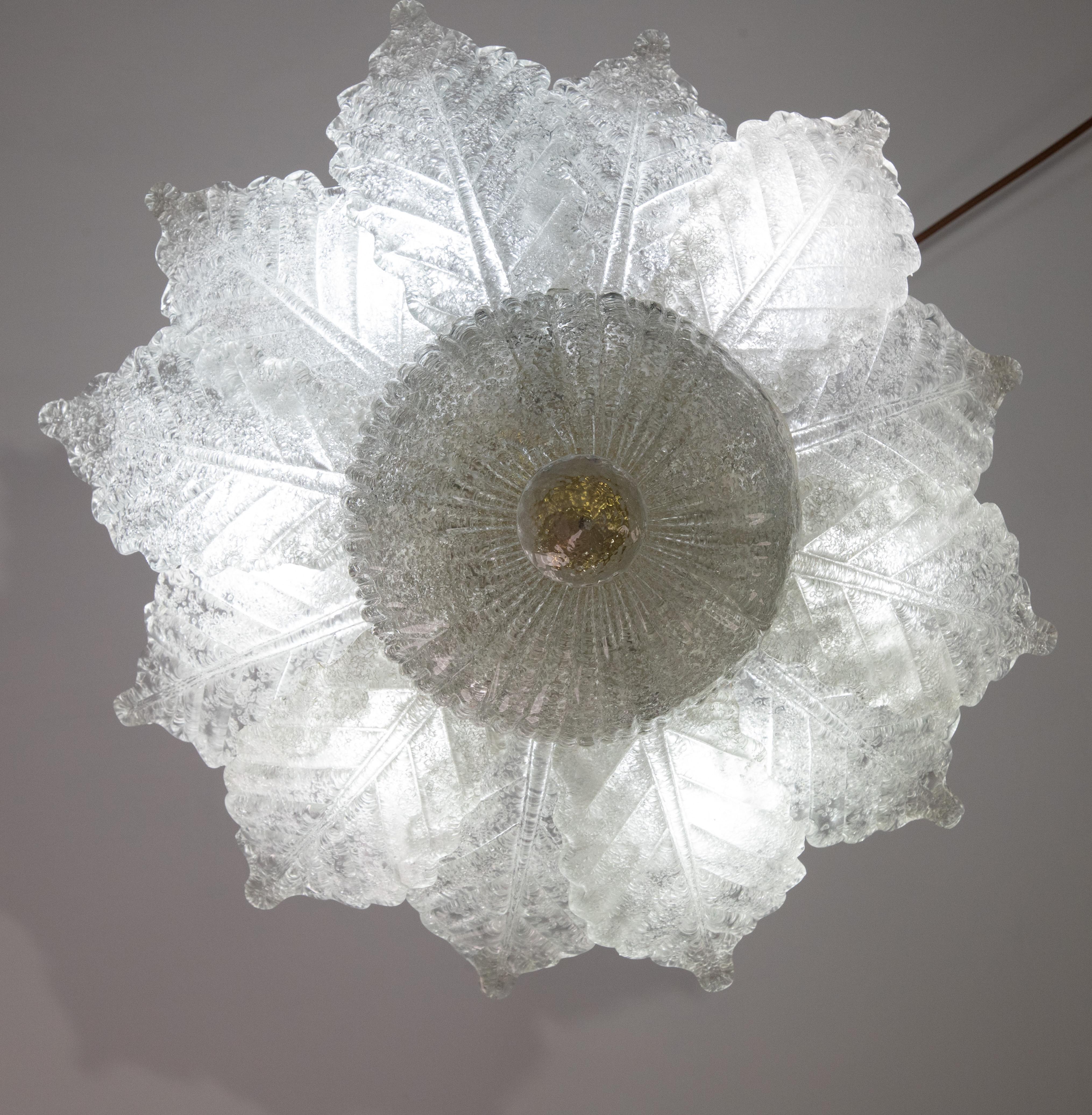 Splendid Murano glass ceiling lamp.

Period: circa 1970.

The light mounts 6 standard European e14 lamp holders.

Height measures 30 centimeters from the ceiling, diameter about 50 centimeters.