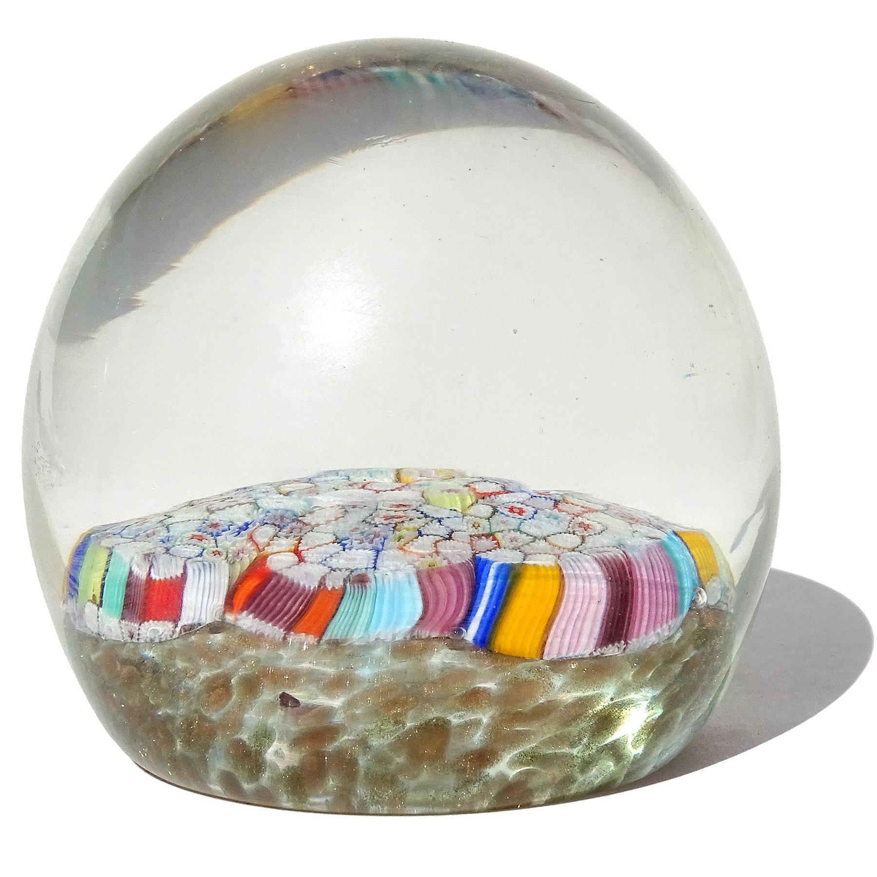 Beautiful and colorful vintage Murano hand blown rainbow color flower murrines over copper bed Italian art glass paperweight. Documented to the Fratelli Toso company. The paperweight is done with 7 larger hexagonal murrines, each of them made from