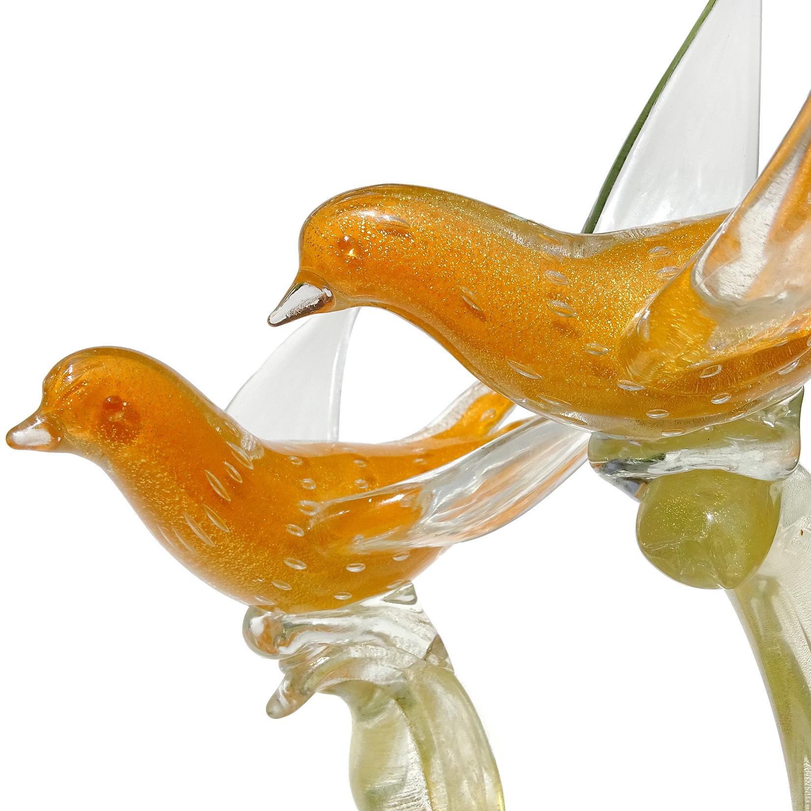 Beautiful vintage Murano hand blown orange, controlled bubbles and gold flecks Italian art glass birds on tree branch sculpture. Attributed to designer Alfredo Barbini. The birds are beautifully sculpted with clear wings, and profusely filled with