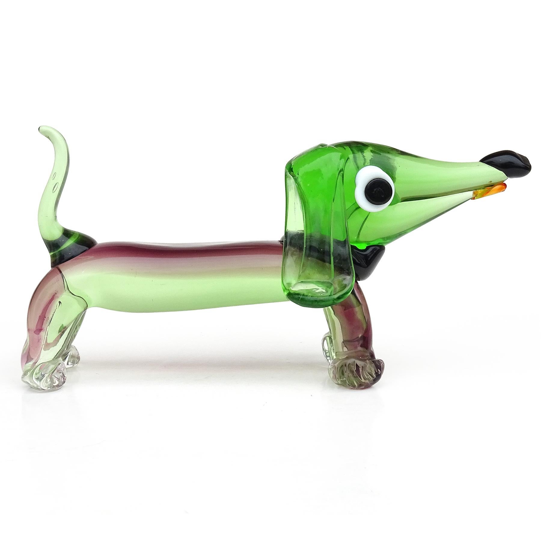Beautiful, and large, vintage Murano hand blown Sommerso green and purple Italian art glass Dachshund puppy dog sculpture. The puppy has a cartoony feel, with black collar, floppy ears, and tongue sticking out. It has very large eyes, and a curled