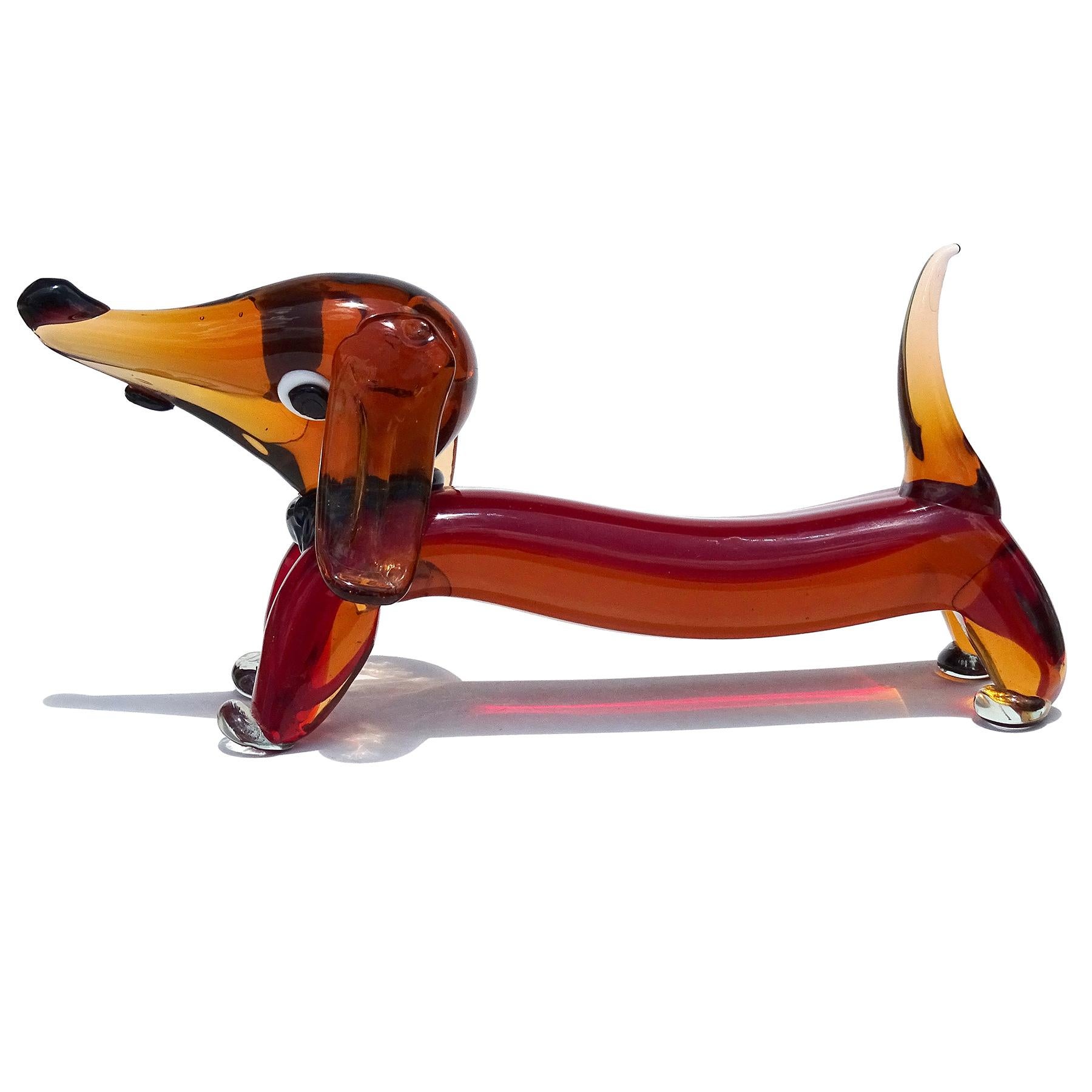 Beautiful, and large, vintage Murano hand blown Sommerso dark orang and red Italian art glass Dachshund puppy dog sculpture. The puppy has a cartoony feel, with black collar, floppy ears, and tongue sticking out. It has very large eyes, and a cute