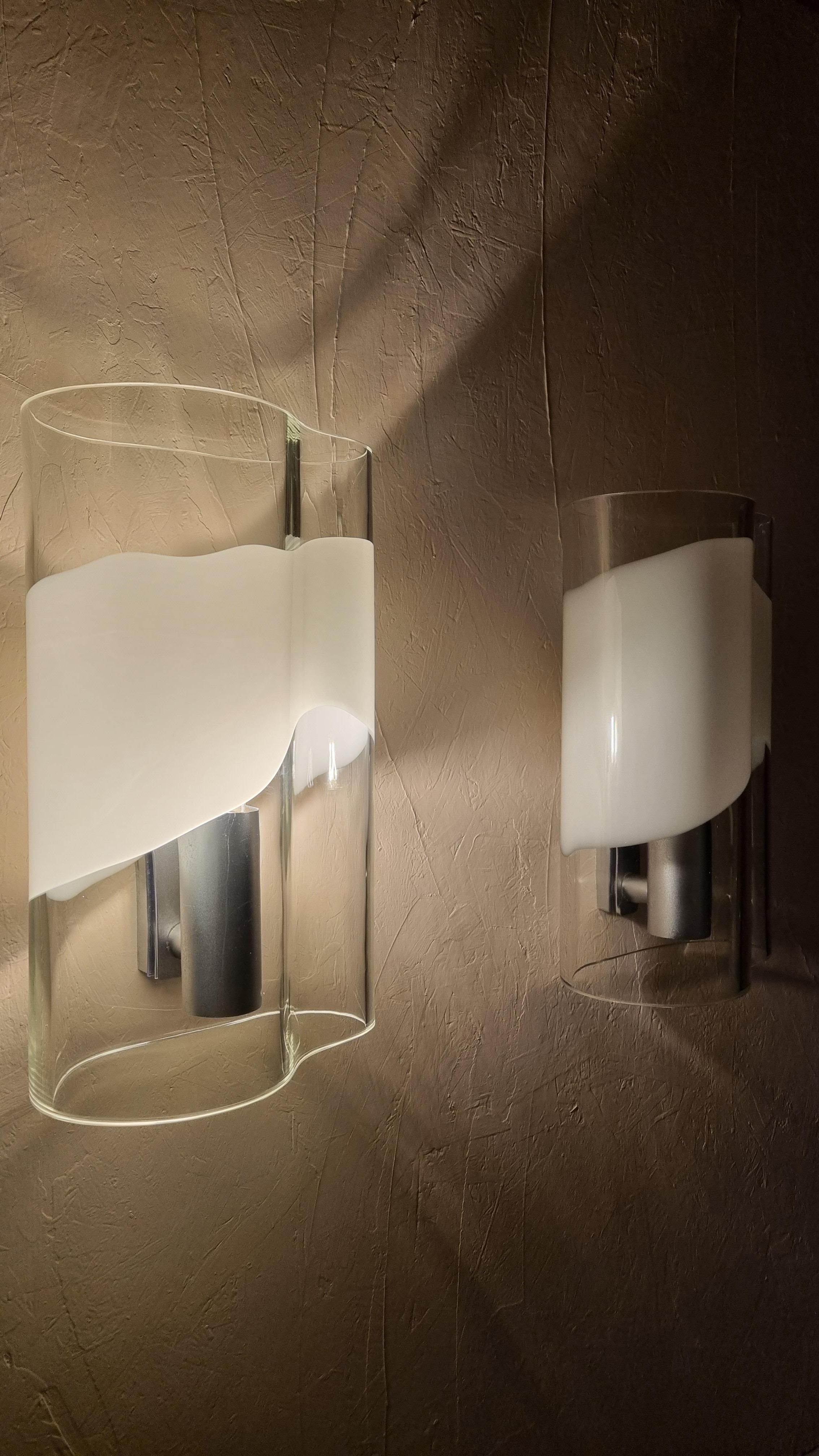 Murano glass and aluminium wall sconces designed by Carlo Nason for Mazzega, 1970s.
The lamps are in excellent condition, electrical system overhauled, fully functional.