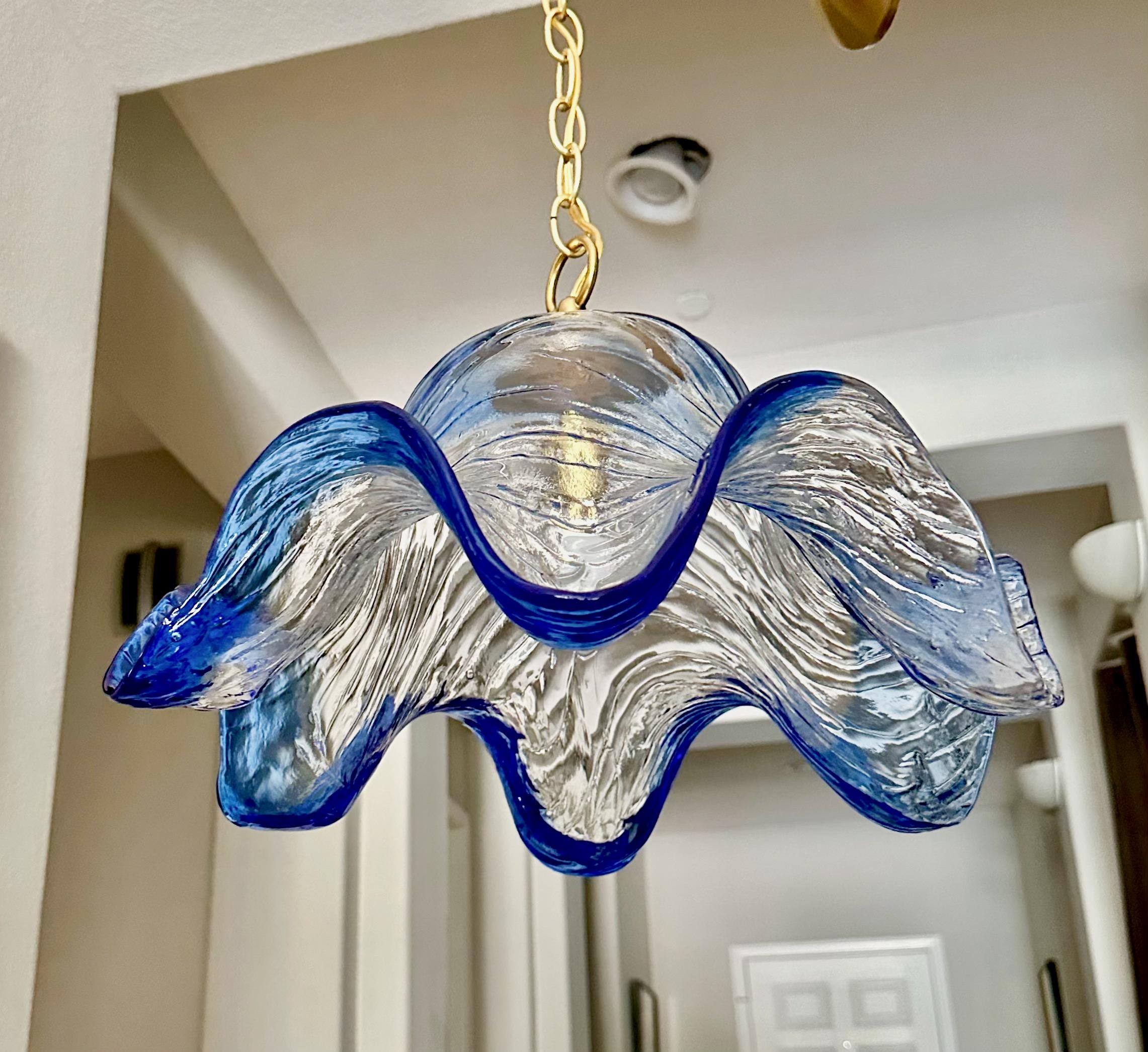Italian Murano Carlo Nason blue and clear textured glass pendant chandelier. Fixture uses regular A base bulb. Newly wired with all new brass fittings including chain and ceiling cap. Perfect for hall, entry or breakfast eating area. 
Fixture size