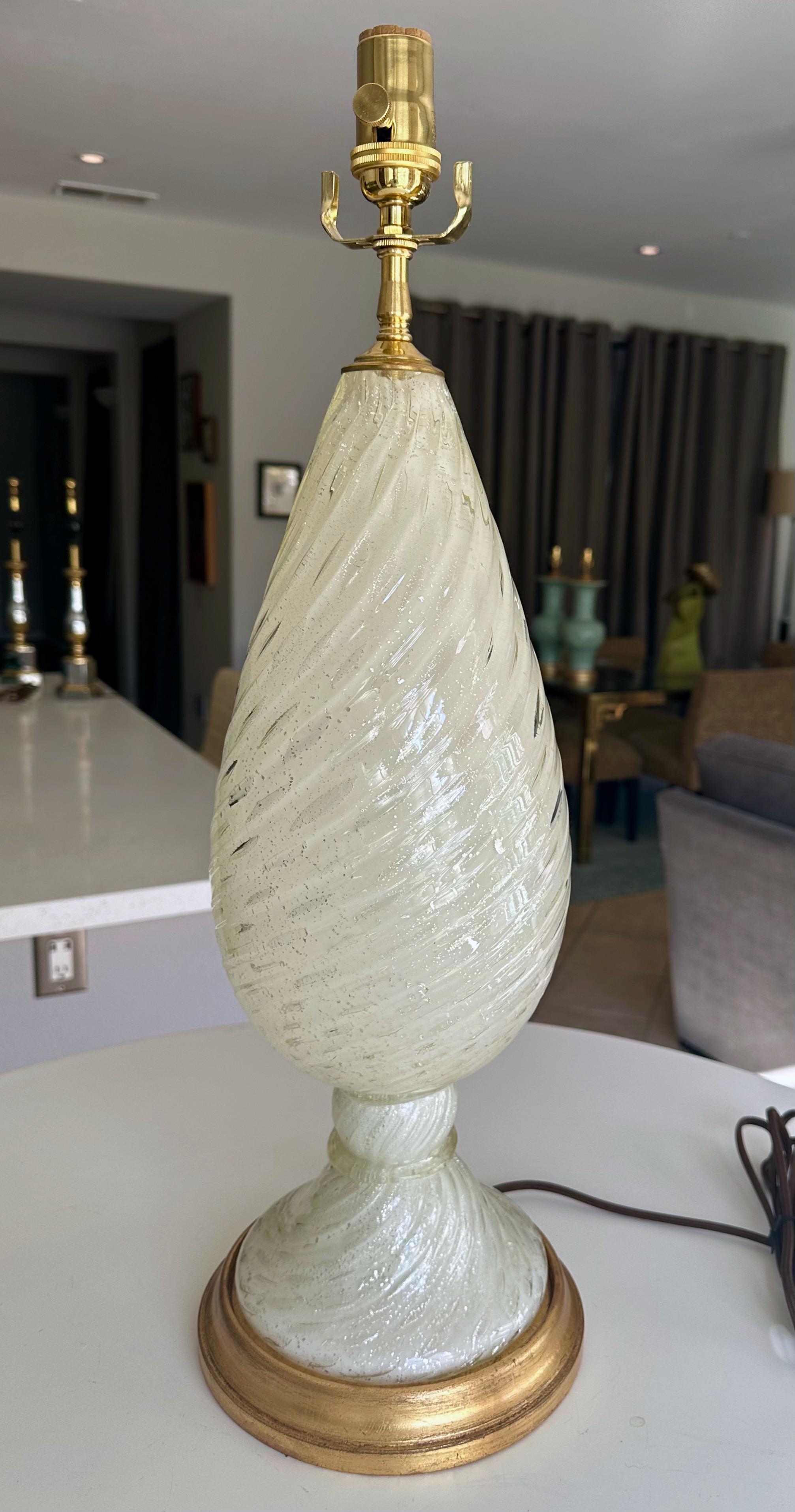 Murano Italian hand blown white twisted glass table lamp with silver inclusion flecks throughout on gilt wood base. Rewired with new brass fittings including new three-way brass socket and rayon cord. 

Overall height top of socket 24
