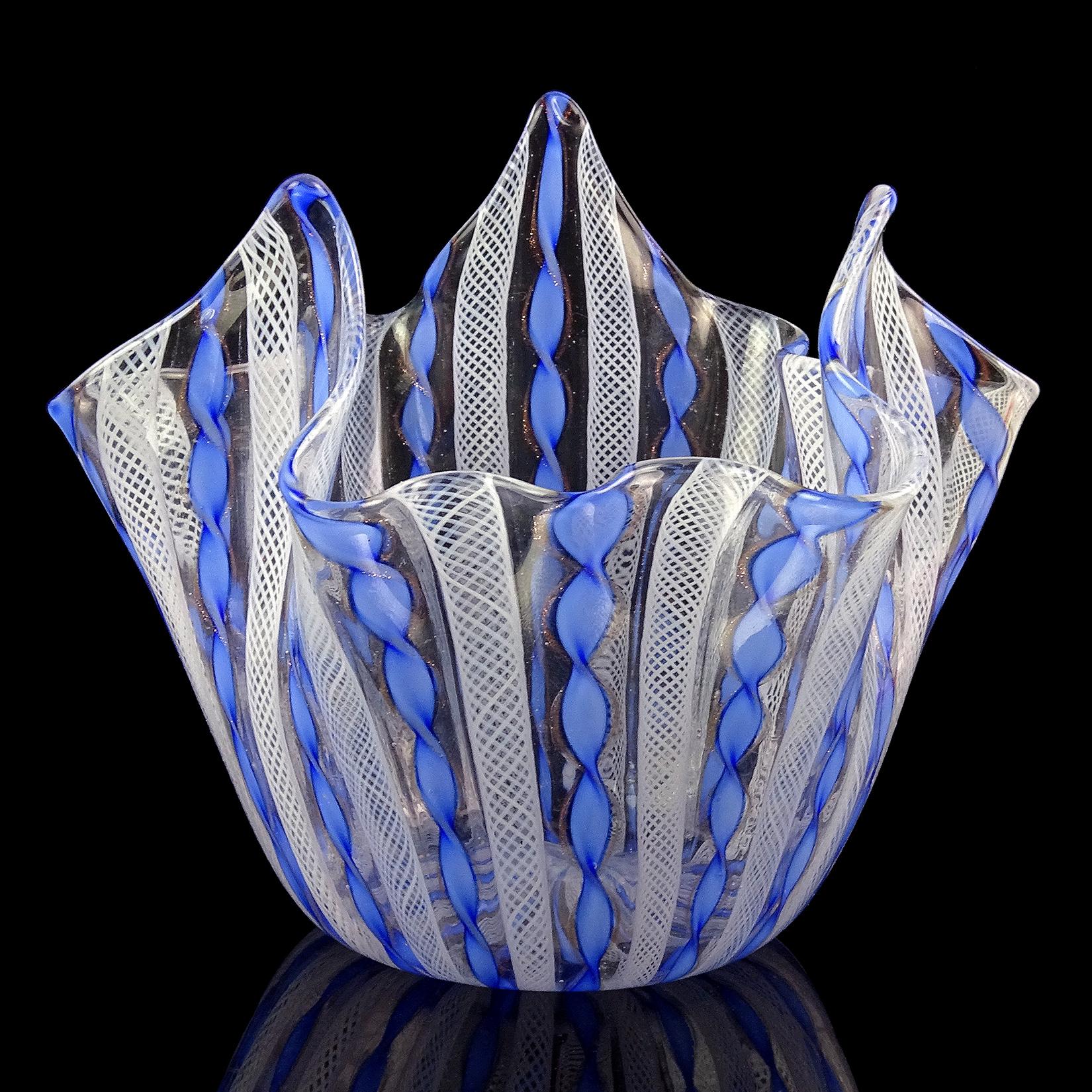 Beautiful vintage Murano hand blown blue, aventurine and white Italian art glass fazzoletto flower vase. Documented to the Fratelli Toso company. The piece is made with twisting blue and copper aventurine fleck ribbons, and white net Zanfirico in an