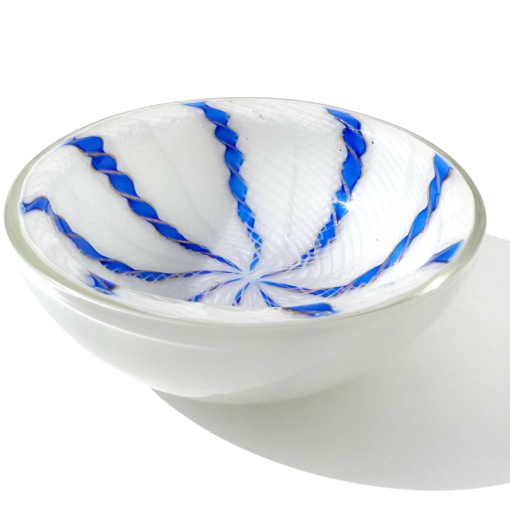 Beautiful vintage Murano hand blown white Zanfirico, cobalt blue and aventurine Latticino ribbons Italian art glass bowl. Would make a great candy or trinket dish for any table. The older label reads 