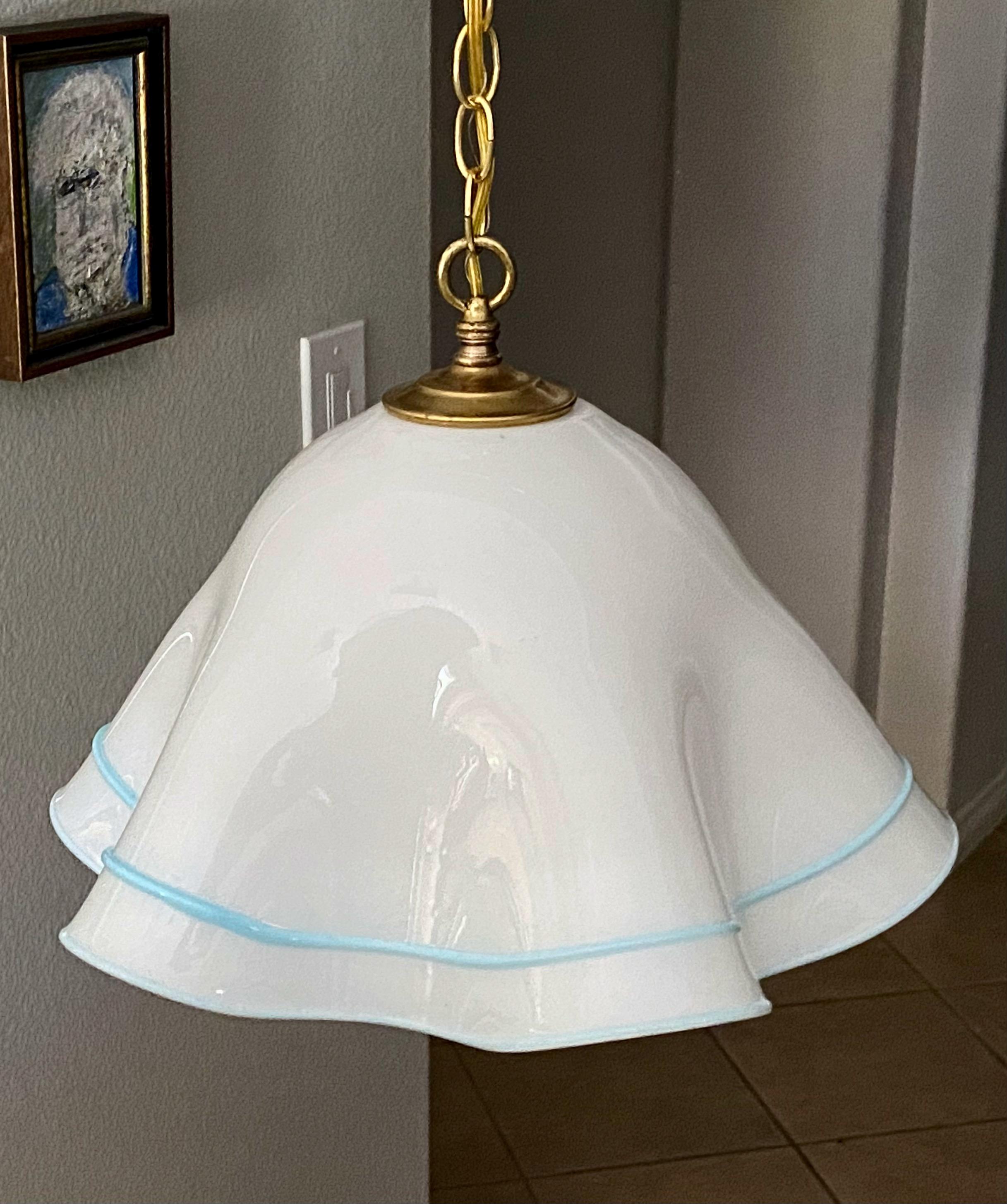Italian Murano handkerchief pendant ceiling light with brass hardware. Hand blown Murano glass body is white with baby blue trim. Uses regular A base bulb. Newly wired. Perfect for hall, entry or breakfast eating area. 
Fixture size 12