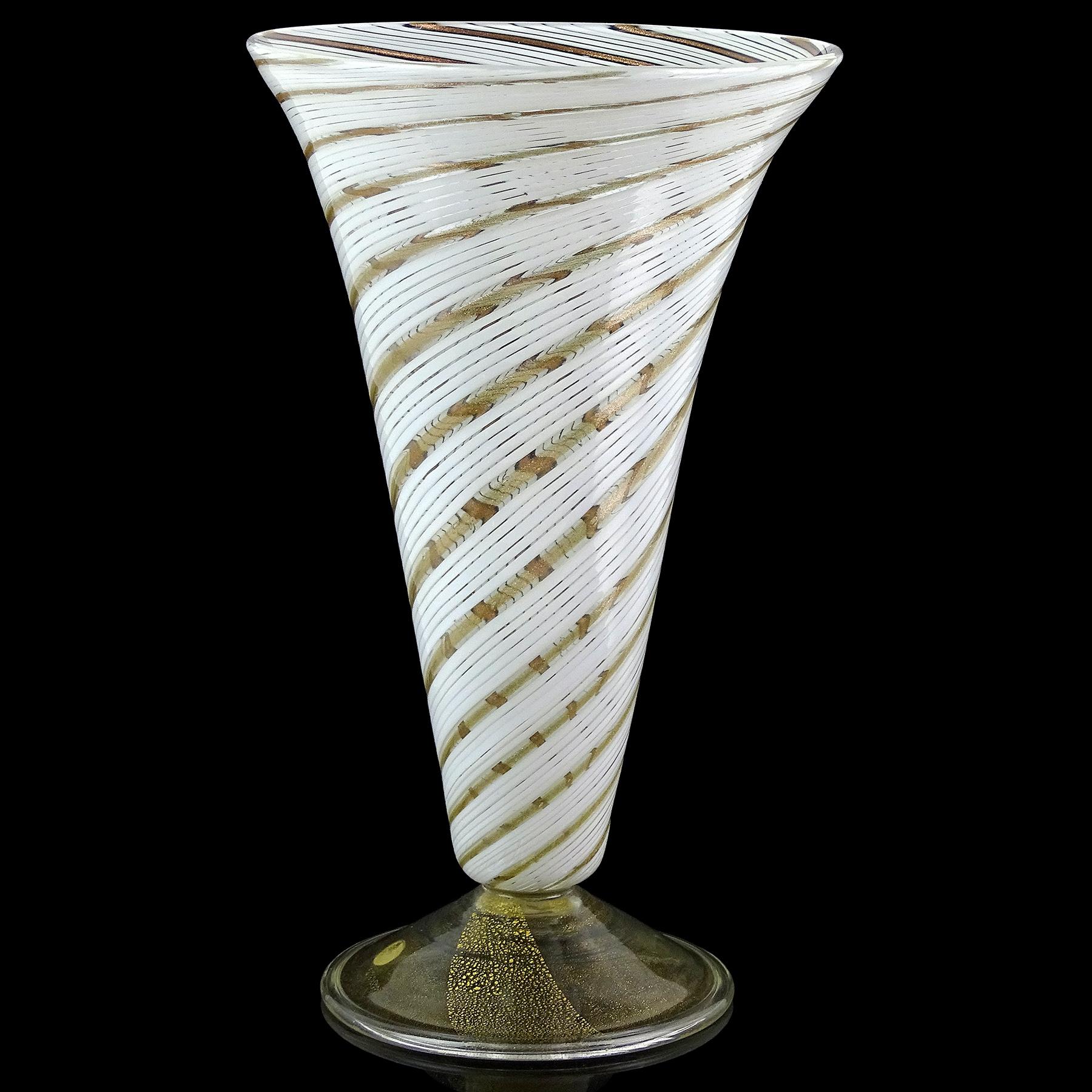 Beautiful vintage Murano hand blown swirling white and aventurine flecks Italian art glass footed flower vase. Atrtibuted to Arte Vetraria Muranese (A.Ve.M.) company, and in the style of designer Dino Martens. The vase is created in the “Mezza