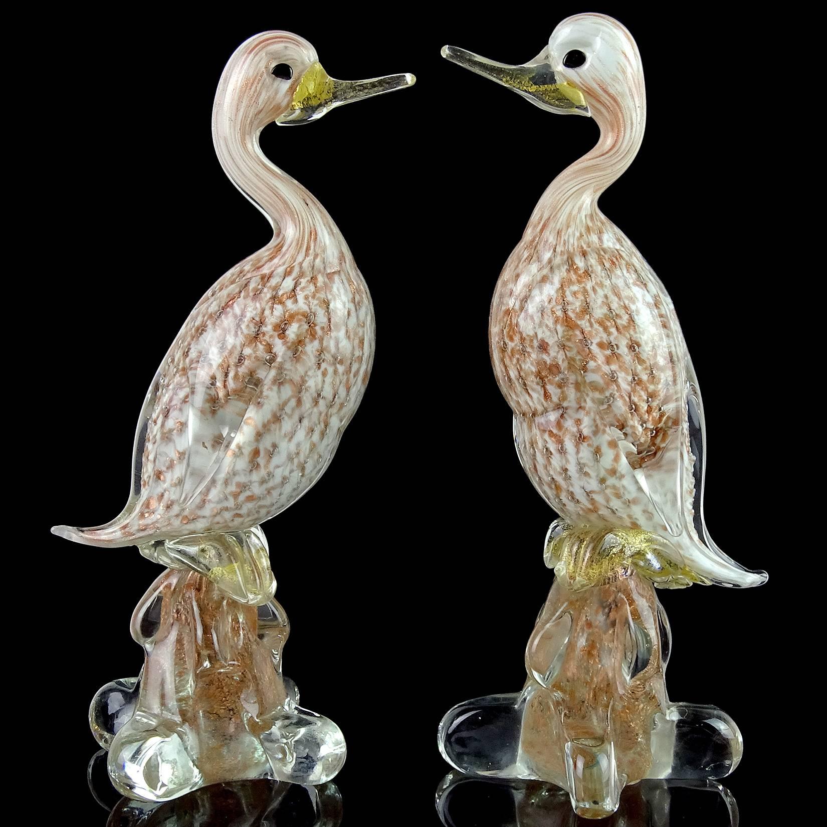 Beautiful pair of vintage Murano hand blown, controlled bubbles, copper aventurine and gold flecks Italian art glass duck sculptures. Attributed to the Fratelli Toso Company. The bubbles in the birds create a starburst design of the aventurine.