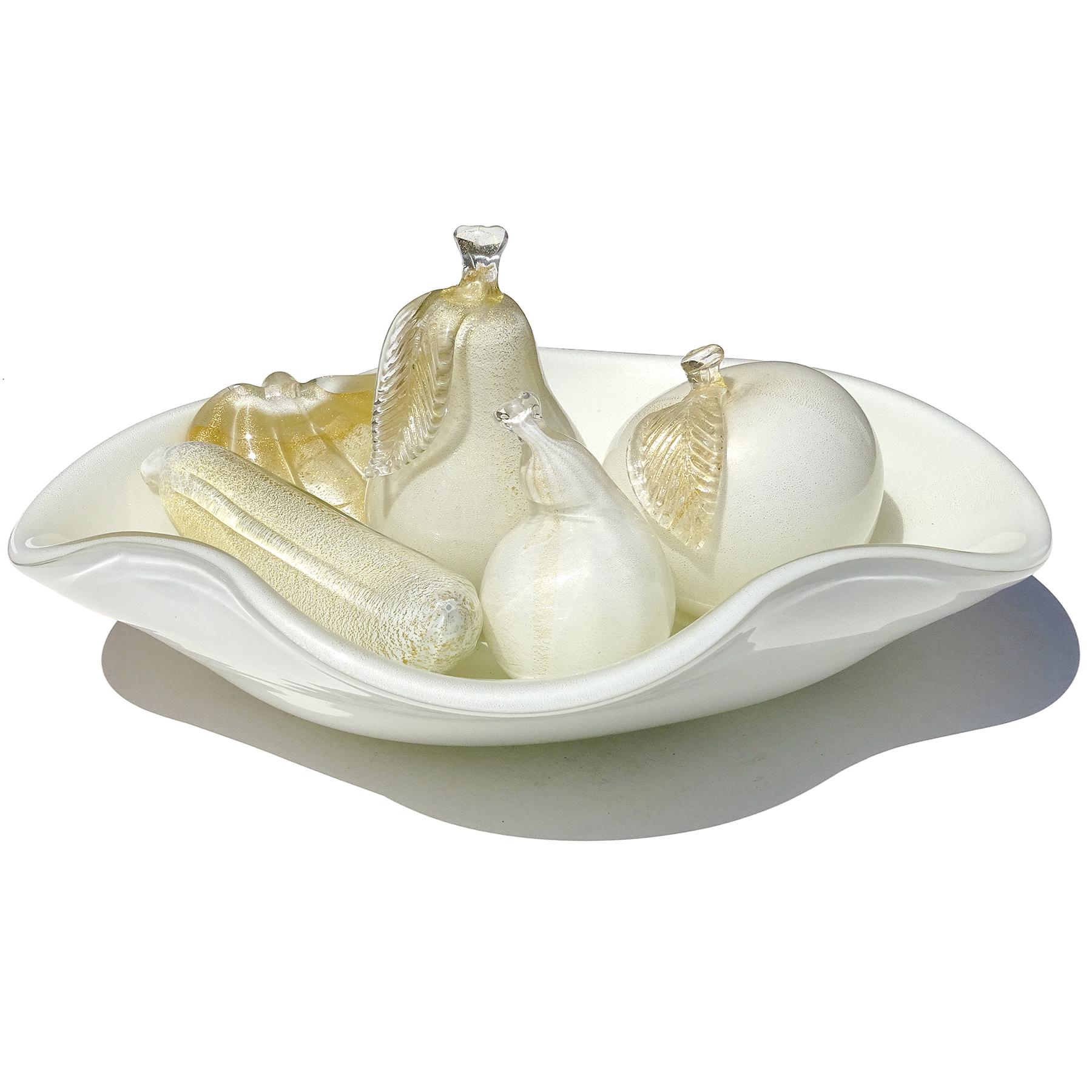 Elegant and very large Murano hand blown gold flecks over white Italian art glass conch shell centerpiece bowl along with 4 different fruit sculptures. Attributed to designer Alfredo Barbini. The bowl has a clear and gold leaf handle, on a wavy,