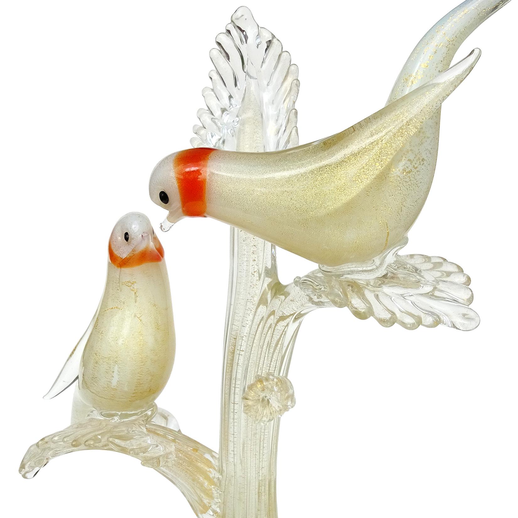 Beautiful, large, vintage Murano hand blown white and gold flecks Italian glass courting orange ring neck dove birds on a branch sculpture. Documented to the Seguso Vetri d'Arte company, recently found on their illustrated archives, item number