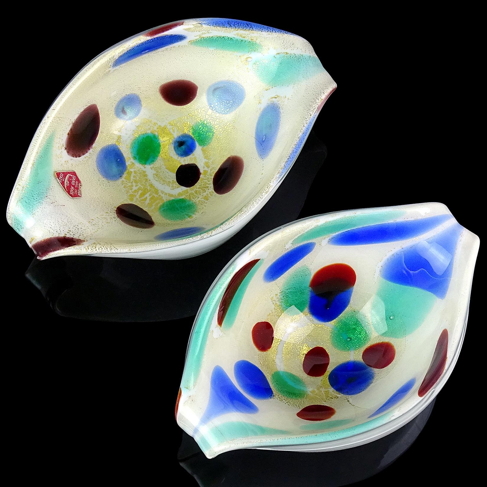 Priced per item (2 available). Beautiful vintage Murano hand blown red, blue and green spots Italian art glass scroll shell bowls, with gold flecks. Profusely covered in heavy gold leaf on the inside. One has an import label which reads 