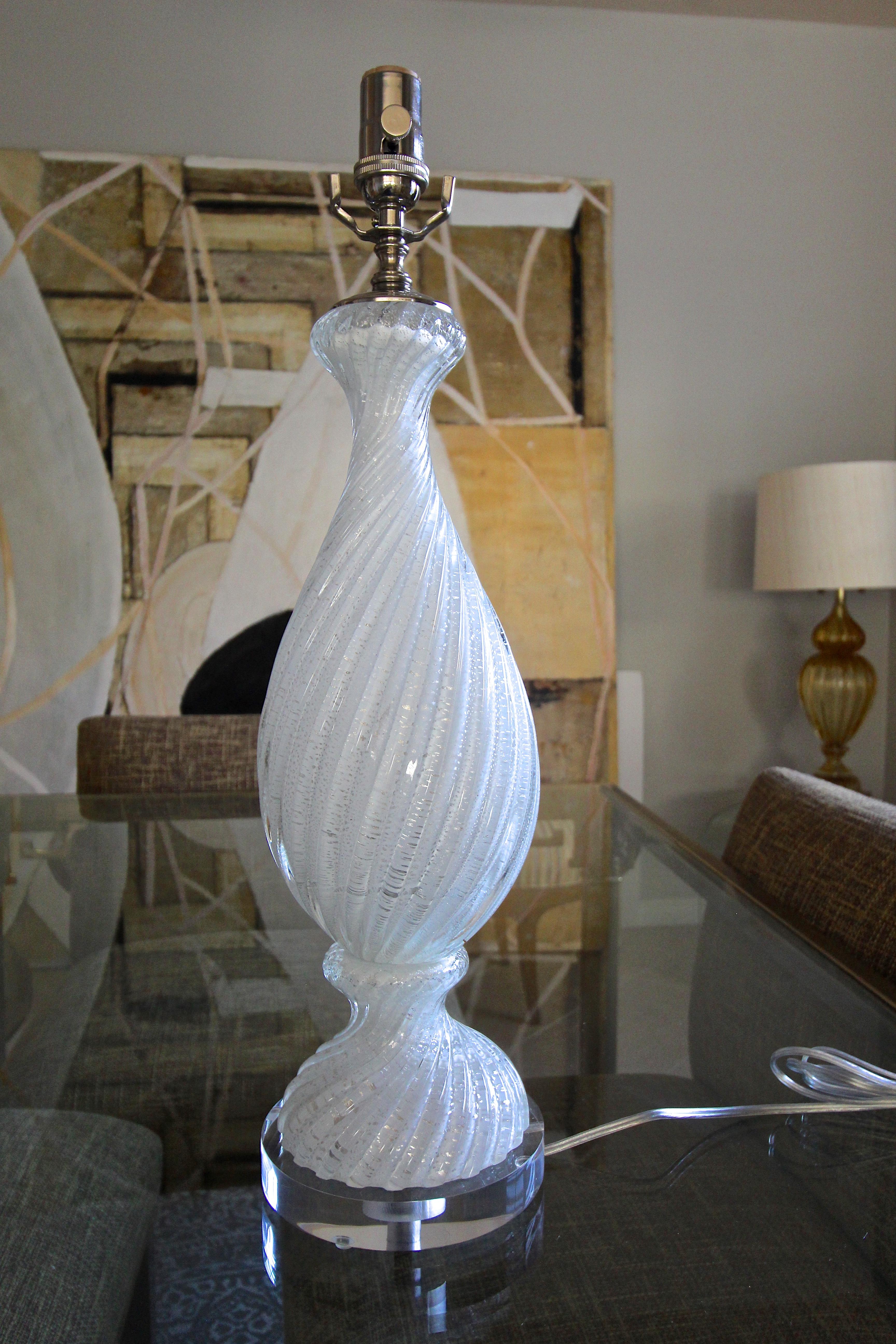Murano Italian hand blown white twisted glass table lamp with silver mica flecks throughout on custom acrylic base. Rewired with all new polished nickel fittings including new three way socket and cord. This handsome lamp trikes the perfect balance